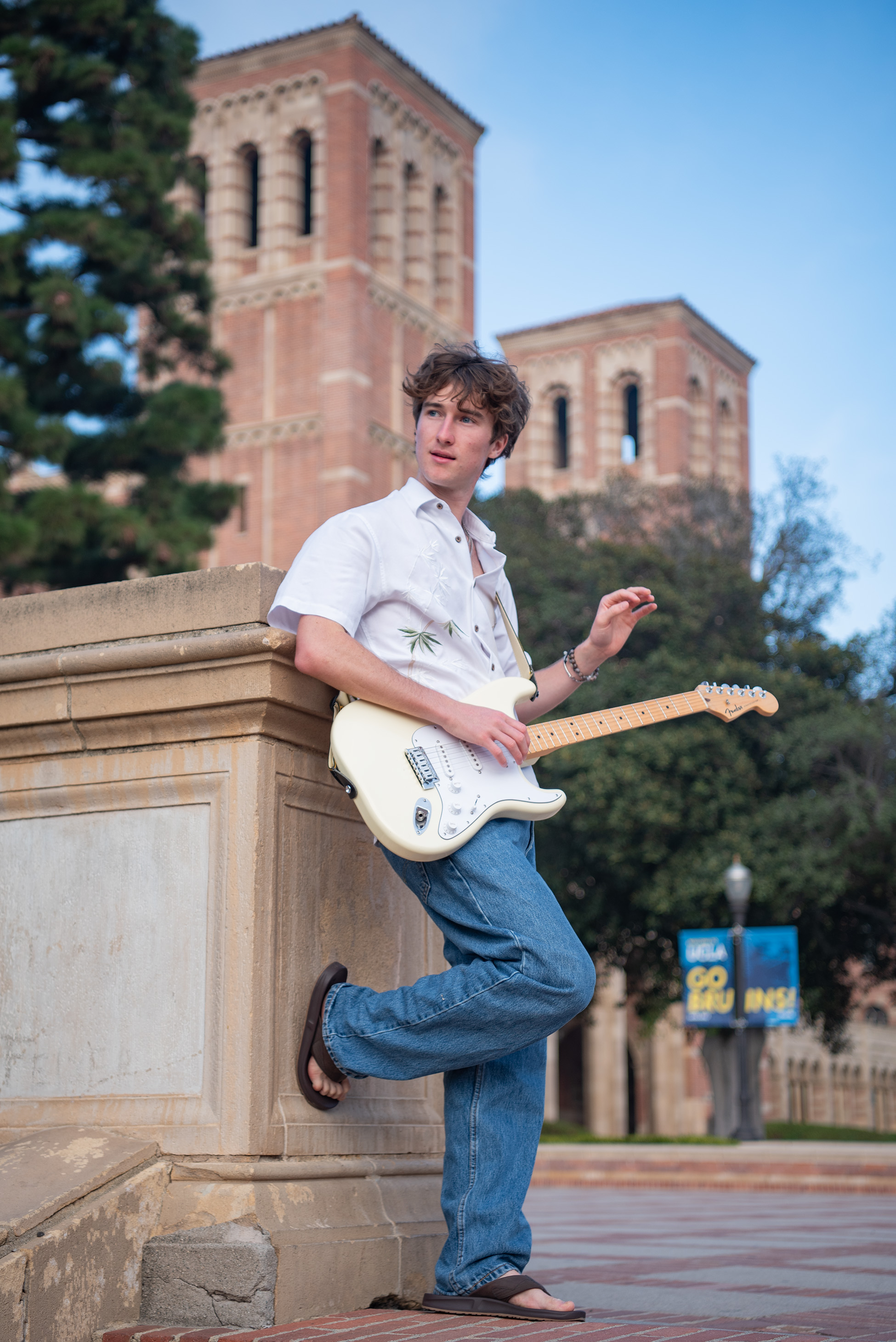 Leaning on top of the steps is Wright, looking to the side with Royce Hall in the background. The student said that although he often performs indie-pop pieces, his personal taste leans toward soul-infused genres such as R&B. (Crystal Tompkins/Daily Bruin senior staff)