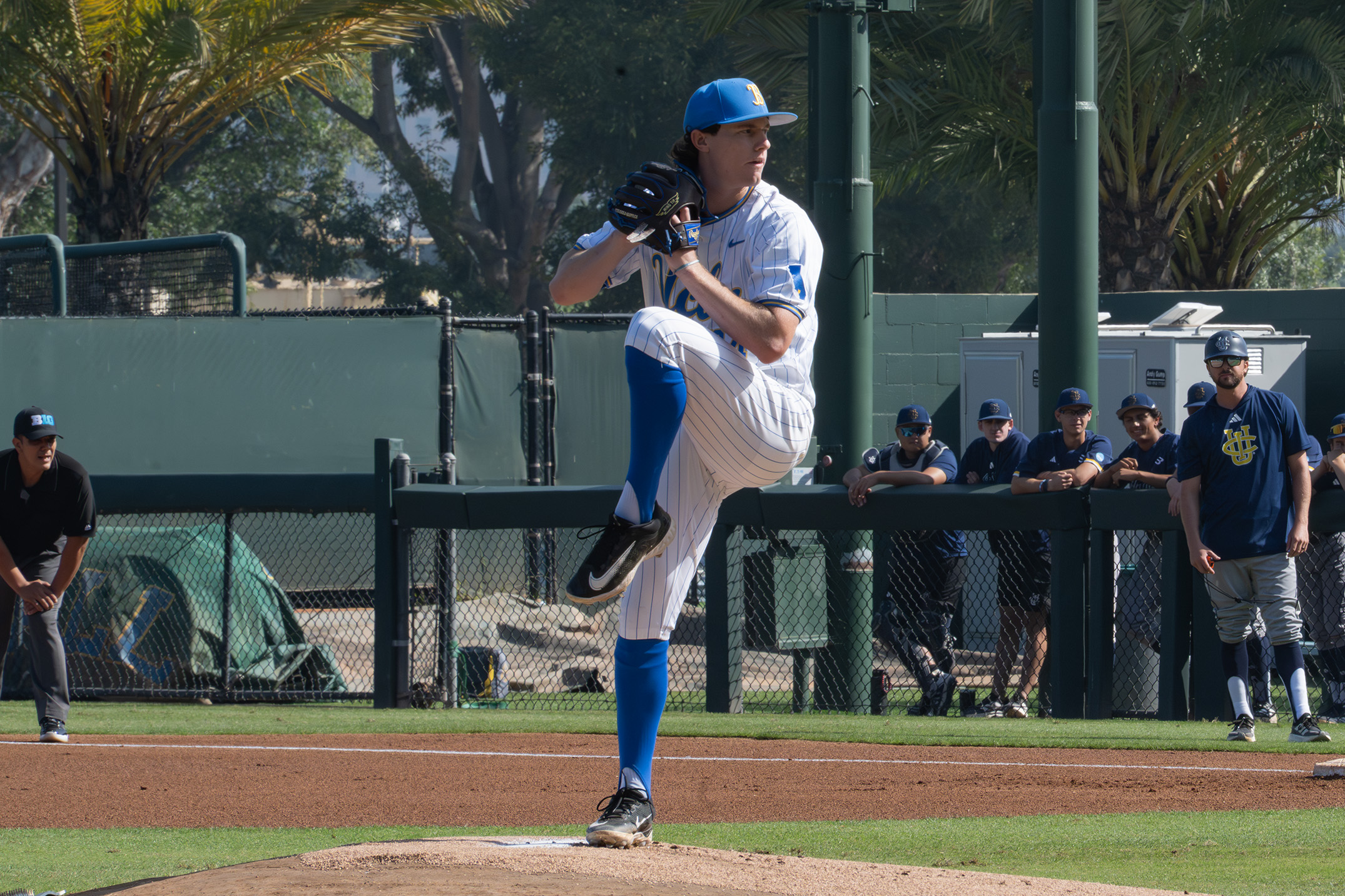 Junior right handed pitcher Logan Reddemann begins his delivery to the plate. (Kai Dizon/Daily Bruin senior staff)