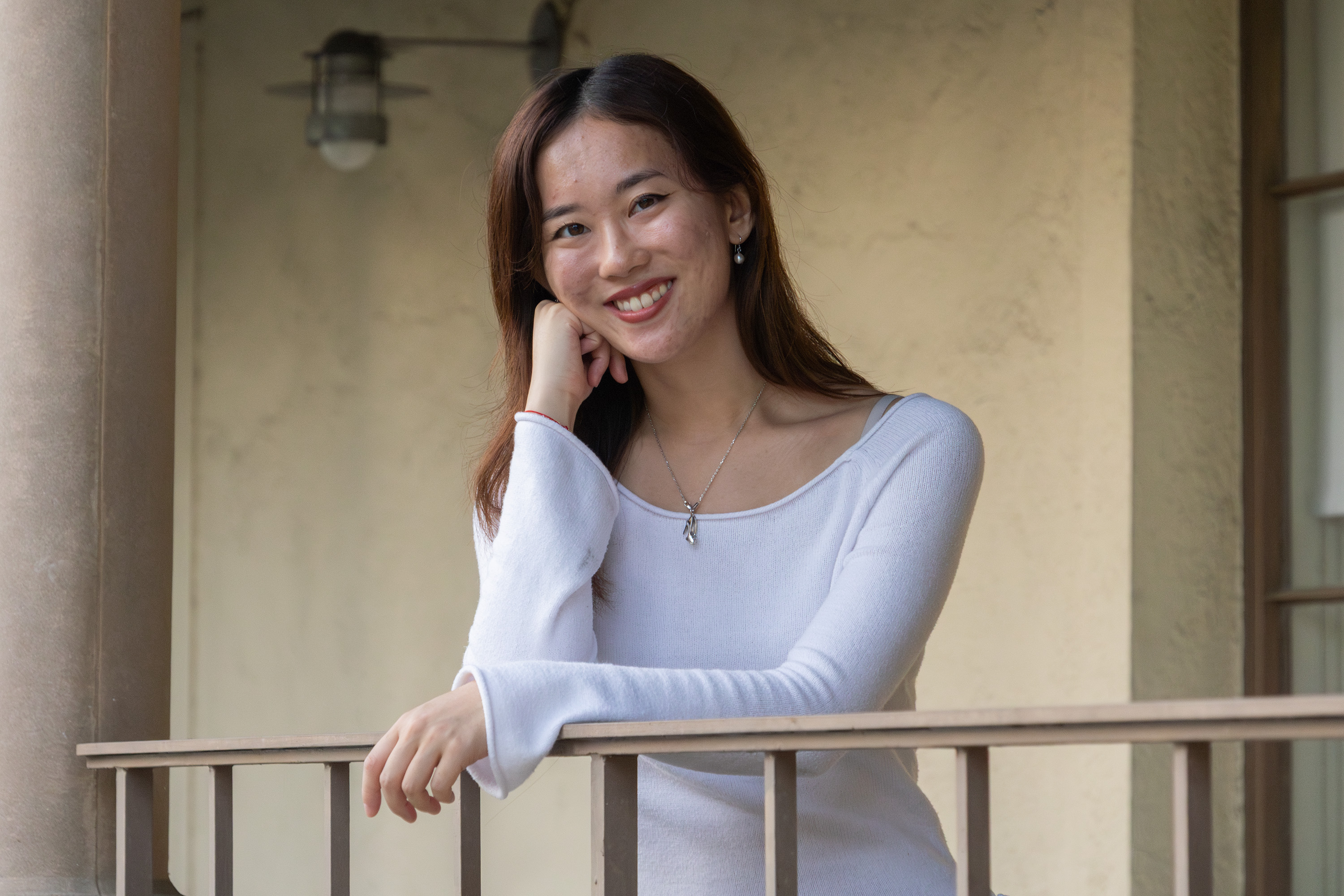 Chu poses with her hand meeting her face, while wearing a white long-sleeve shirt. In a time where the music industry focuses on social media, the independent artist said it can be difficult to navigate this alone, but she has slowly seen more engagement from her audience, making it less challenging. (Selin Filiz/Assistant Photo editor)