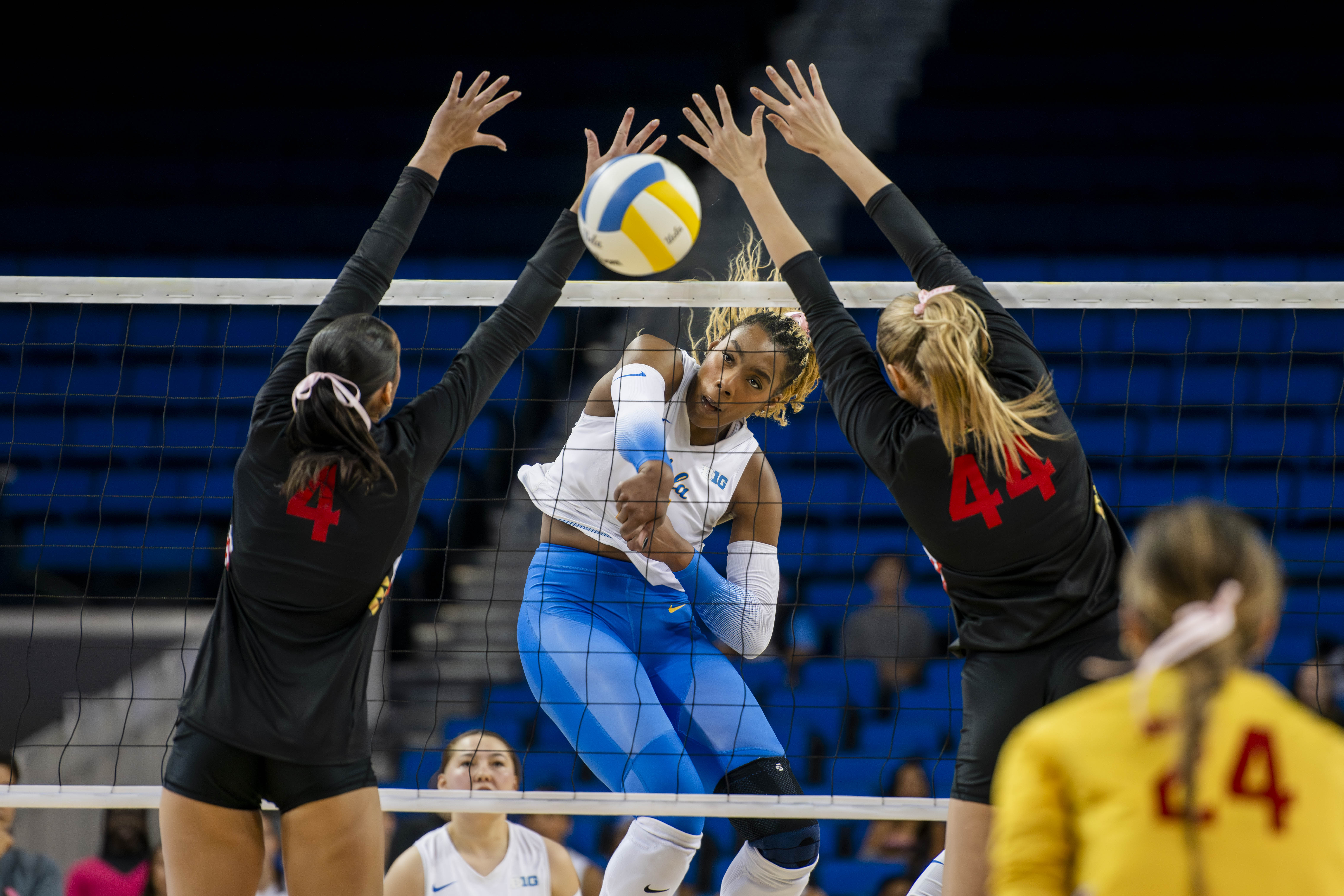 Singletary swings through the opposing team's block. (Edward Ho/Daily Bruin)