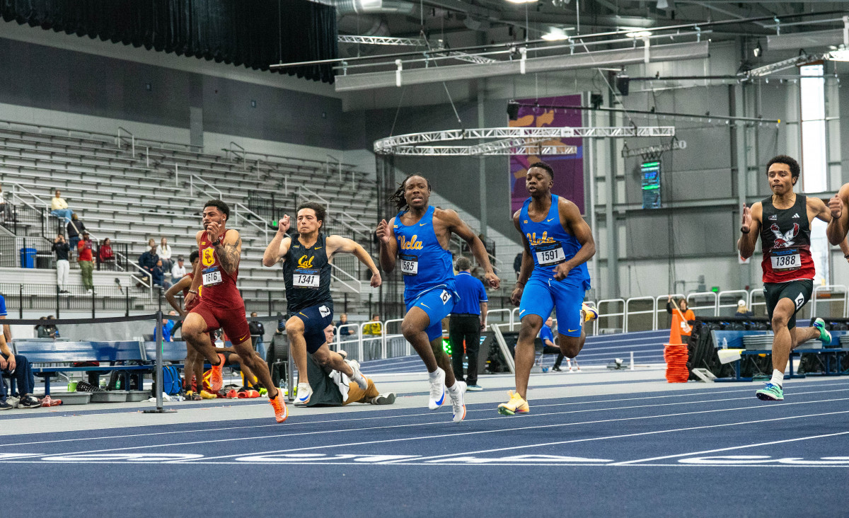 Freshmen Shaun McCoullum and Steven Sabino (left to right) near the finish line in the preliminary round of the 60-meter dash. The freshmen competed in their first collegiate track meet Friday (courtesy of Luca Gillis).