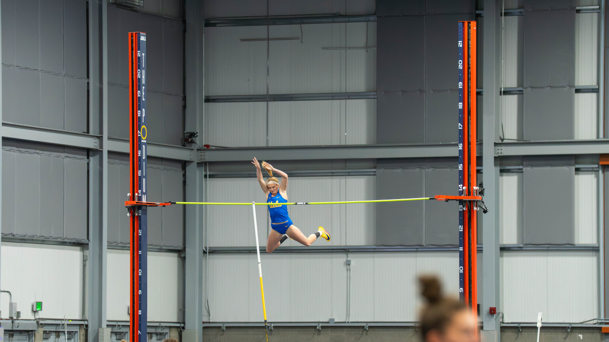 Freshman pole vaulter Paige Echsner pushes herself upward to clear the bar. Echsner attended Del Norte high school in San Diego, where she cleared the 4.21-meter mark in the pole vault. (courtesy of Luca Gillis)