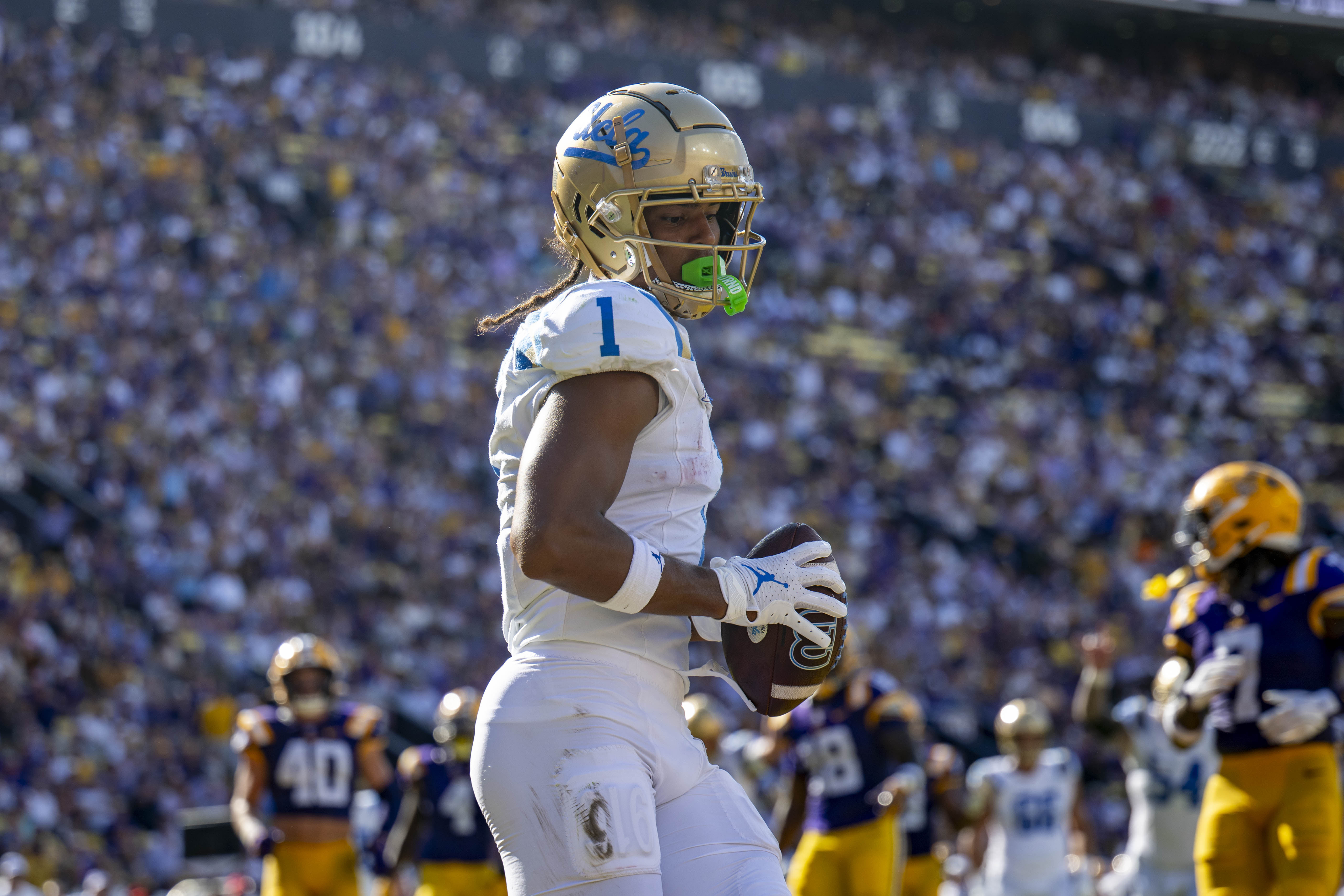 Redshirt sophomore wide receiver Rico Flores Jr. holds the ball at Tiger Stadium.