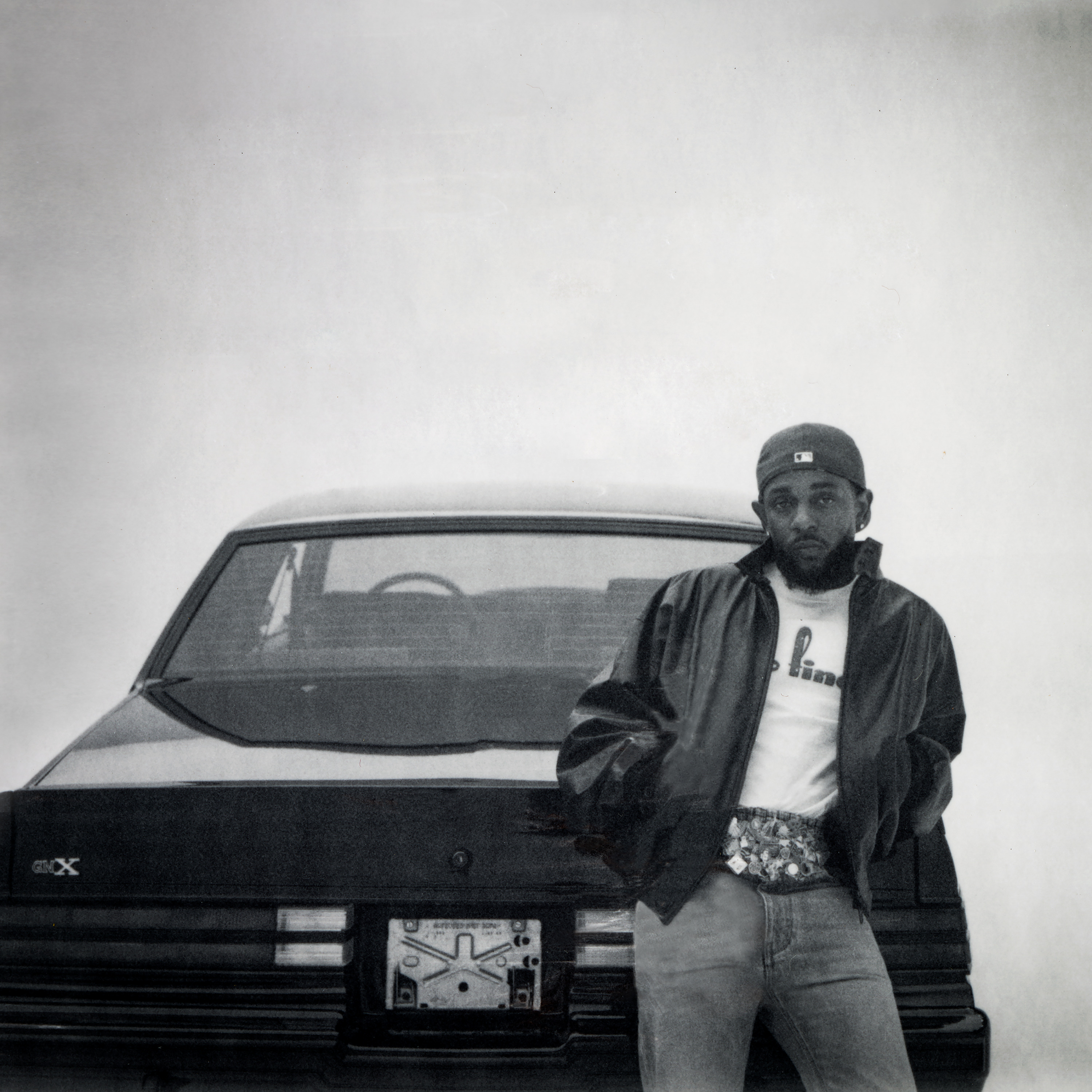 The cover of “GNX” shows a black-and-white picture of Kendrick Lamar leaning against a car. Nominated for Best Rap Album, the 12-track LP includes the tracks “squabble up” and “luther,” with the latter also earning a nomination this year. (Courtesy of SMB Music LLC under exclusive license to Warner Records Inc)