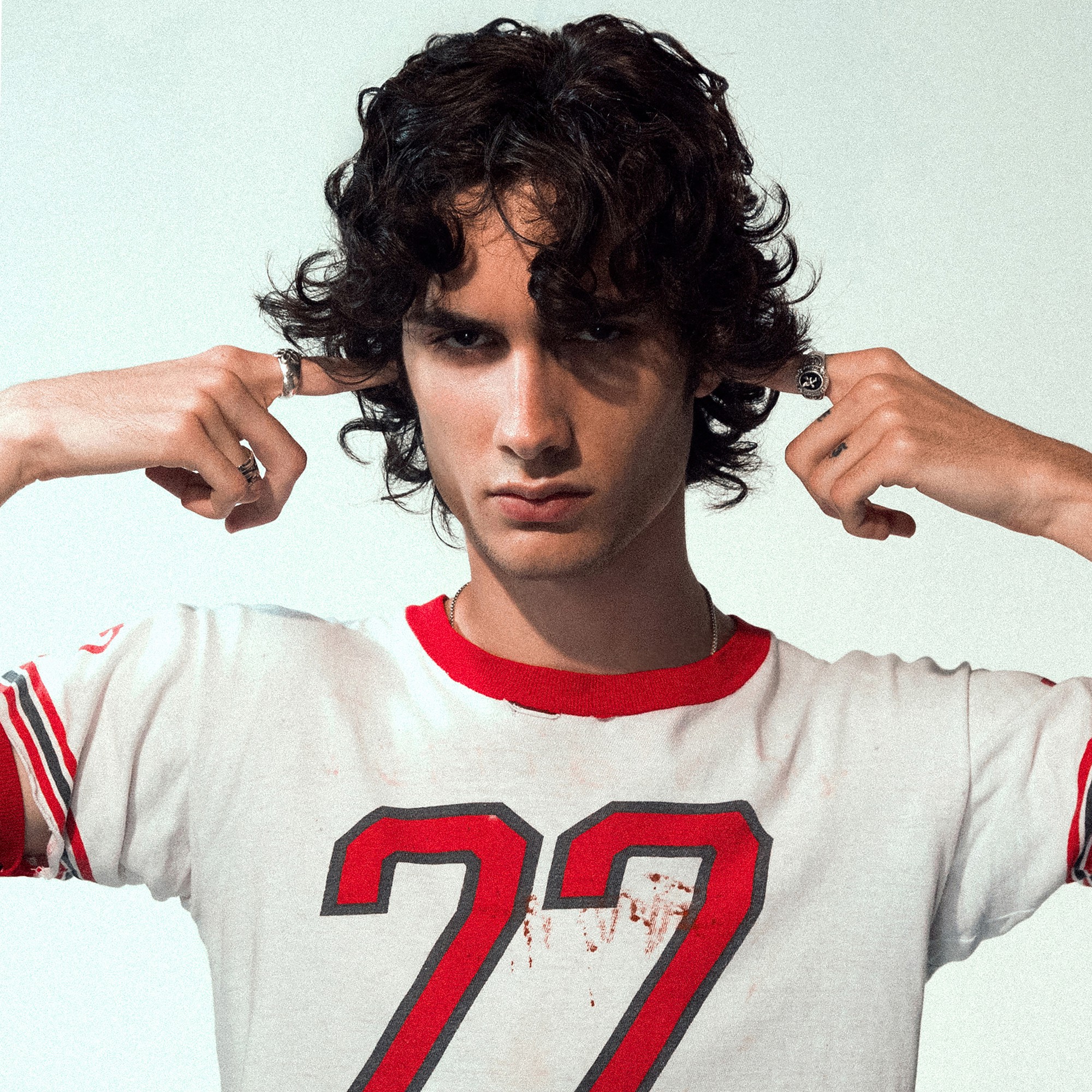 sombr looks at the camera while covering his ears. After his 2024 breakthrough with social media staples like “back to friends,” sombr is nominated for the Best New Artist category. (Courtesy of Columbia Records, a Division of Sony Music Entertainment, as exclusive licensee)