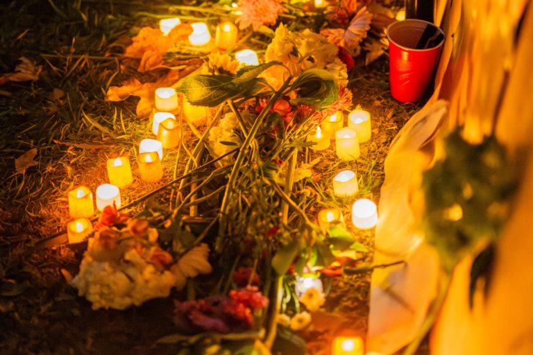 Students gather for vigil honoring people killed by federal agents