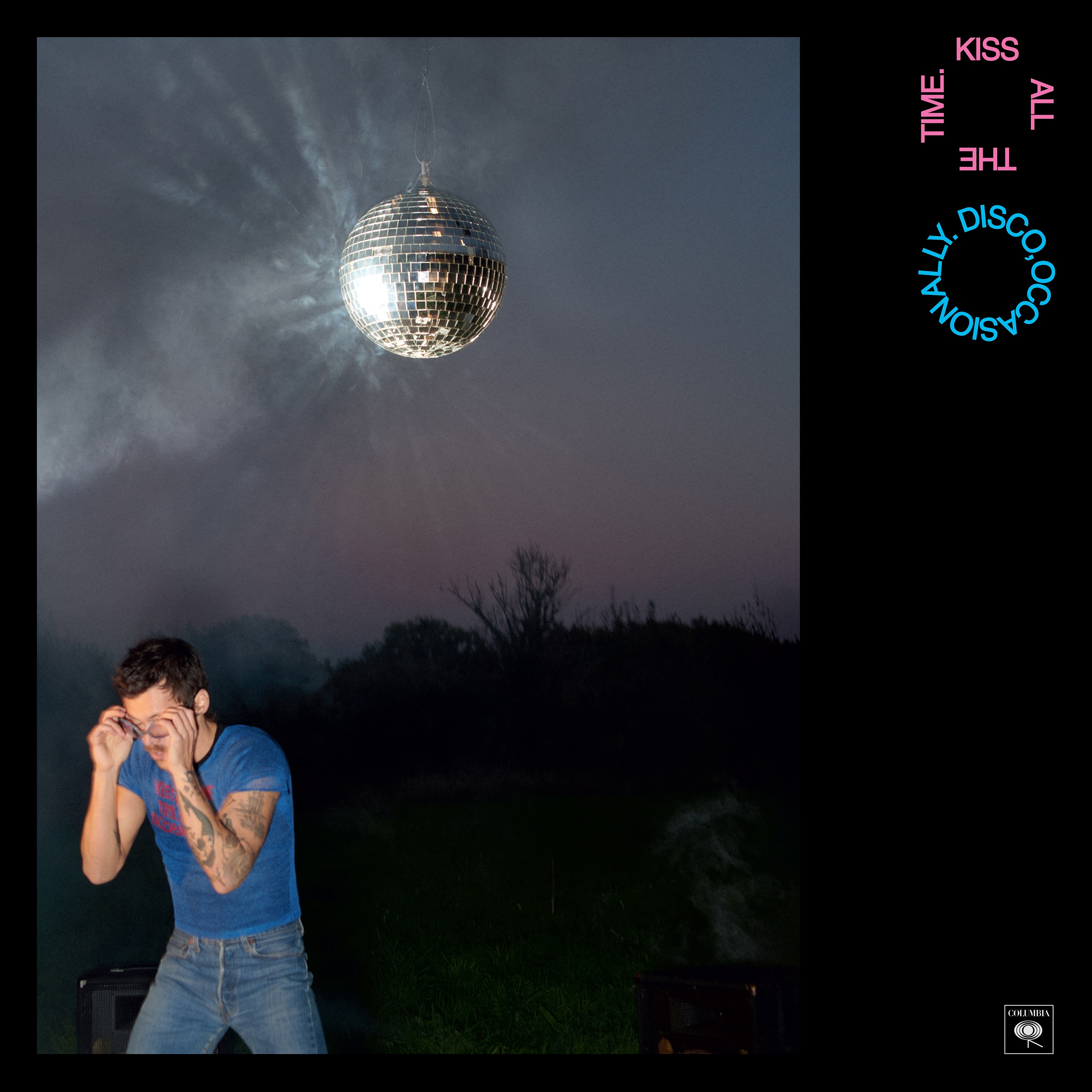 Harry Styles is pictured wearing blue jeans and a blue top, facing away from a disco ball while putting on sunglasses. The British singer&squot;s fourth studio album, "Kiss All The Time. Disco, Occasionally.," will be released March 6 after a 22-month hiatus. (Courtesy of  Erskine Records Limited, under exclusive license to Columbia Records, a Division of Sony Music Entertainment)