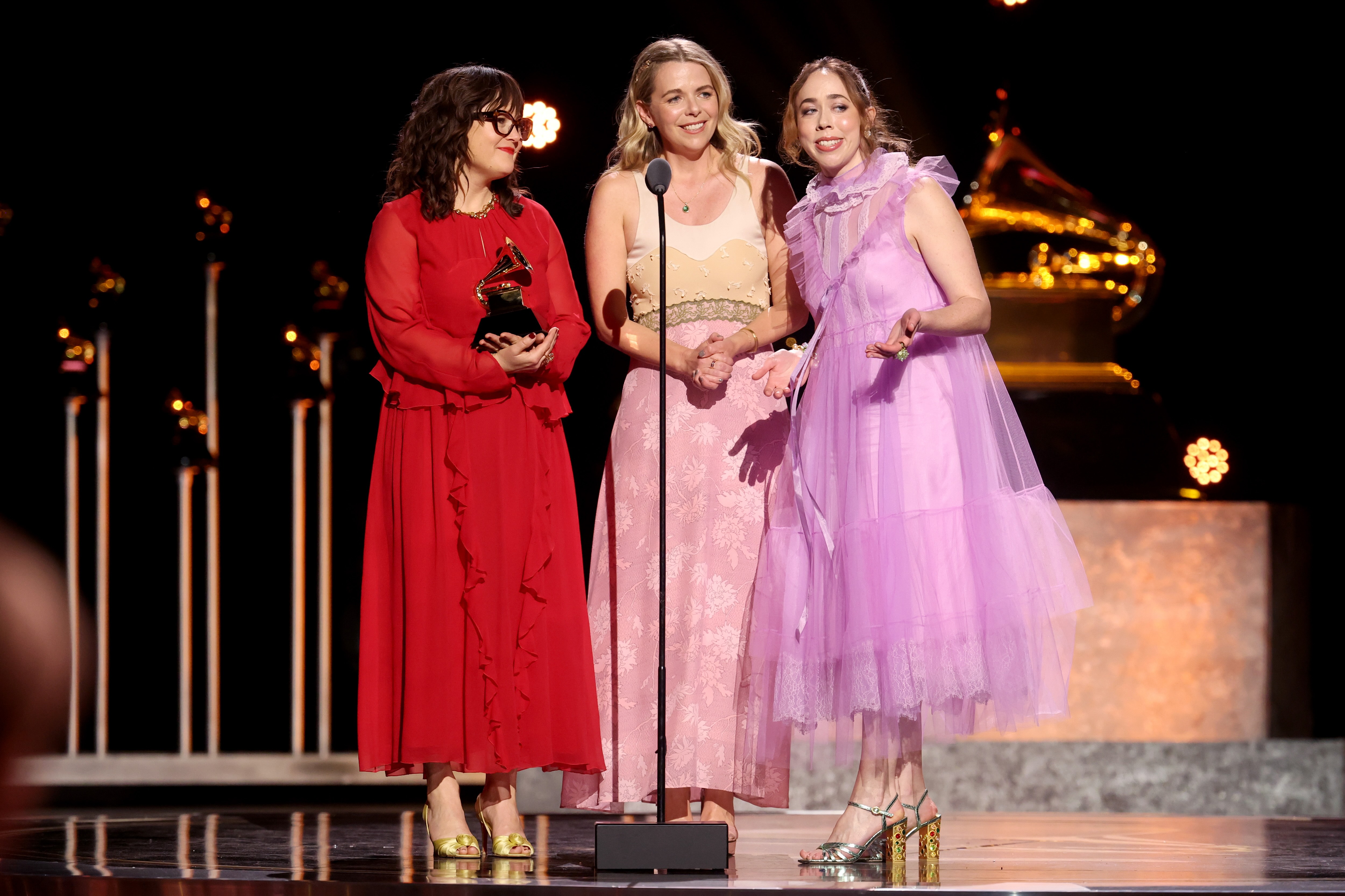 Members of I'm with Her, Sara Watkins (left), Sarah Jarosz(right) and Aoife O'Donovan (middle) give their speech on the Grammy stage. The band took home the Golden Gramophones for Best Folk Album and Best American Roots Song. (Courtesy of Matt Winkelmeyer/Getty Images for The Recording Academy)