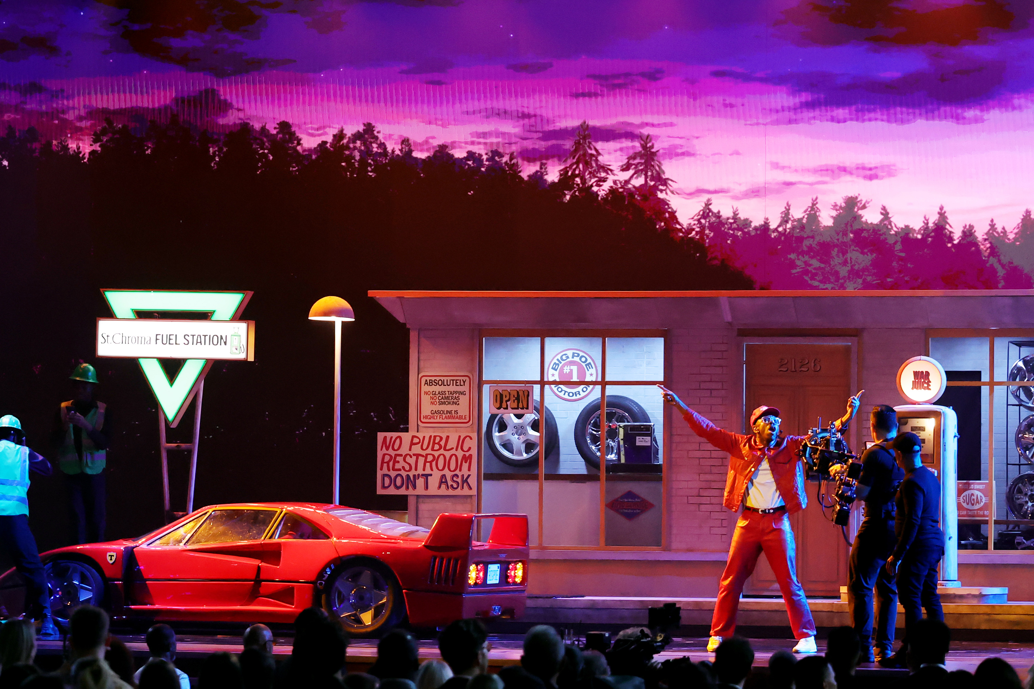 Tyler, The Creator performing the last song of his medley, "Sugar On My Tongue." The rapper&squot;s performance featured detailed stage sets, playing into the "CHROMAKOPIA" and "DON&squot;T TAP THE GLASS" albums. (Courtesy of Getty Images for The Recording Academy)