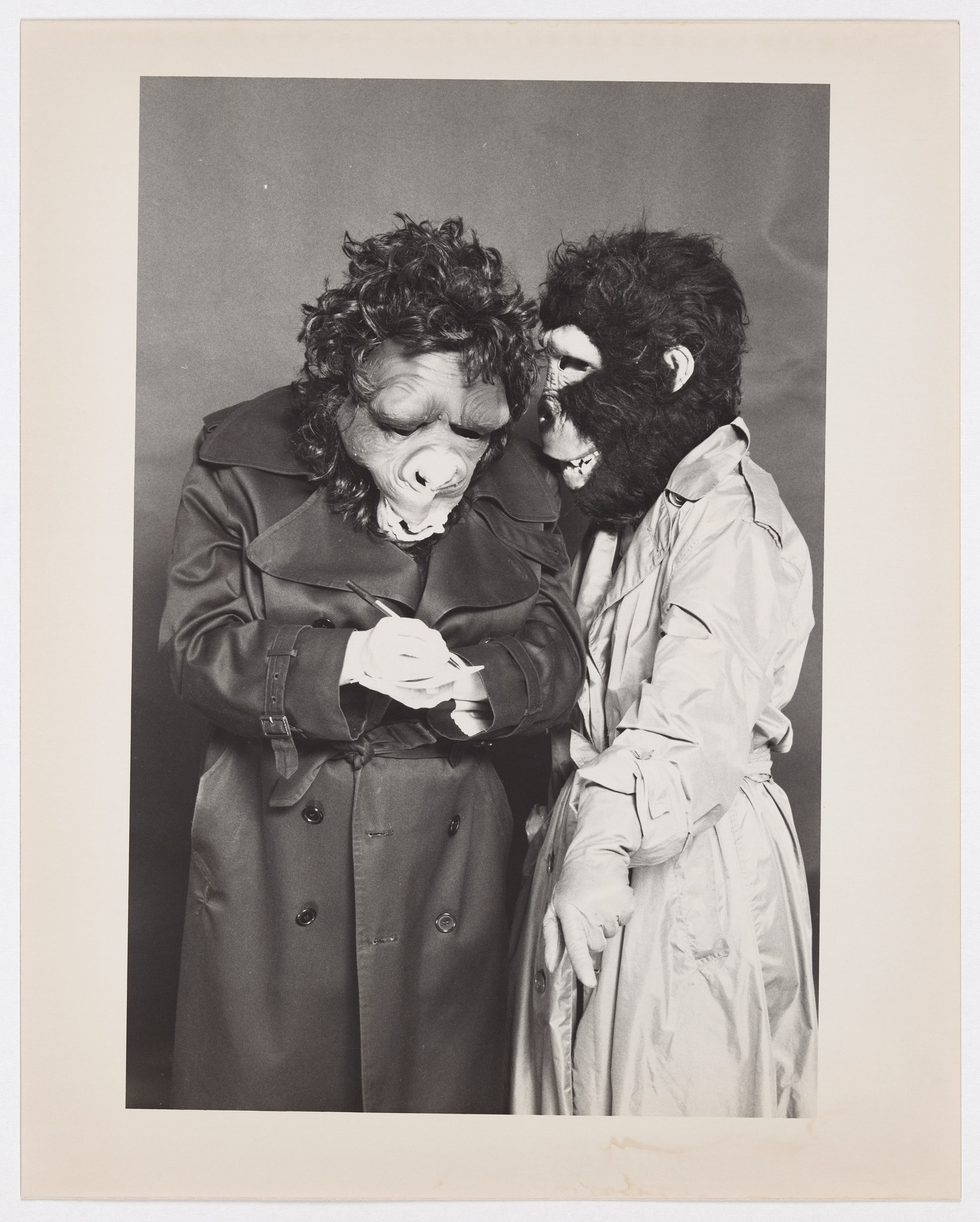 A photo dating to 1987 of two Guerrilla Girls dressed as detectives. Forty years since the foundation of the feminist group, “How to Be a Guerrilla Girl” offers a glimpse into the actions and impact of the feminist collective. (Courtesy of J. Paul Getty Trust)
