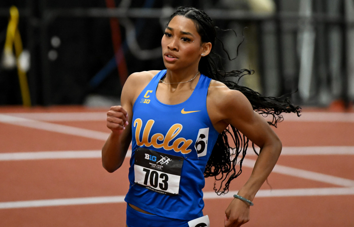 Senior sprinter Naomi Johnson runs around the bank at the Indoor Big Ten championships. Johnson competed in in the 200-meter dash at the same competition last year, placing eight with a time of 23.32, but opted to compete in the 400-meter dash this year, notching a 52.29-second mark to finish third.