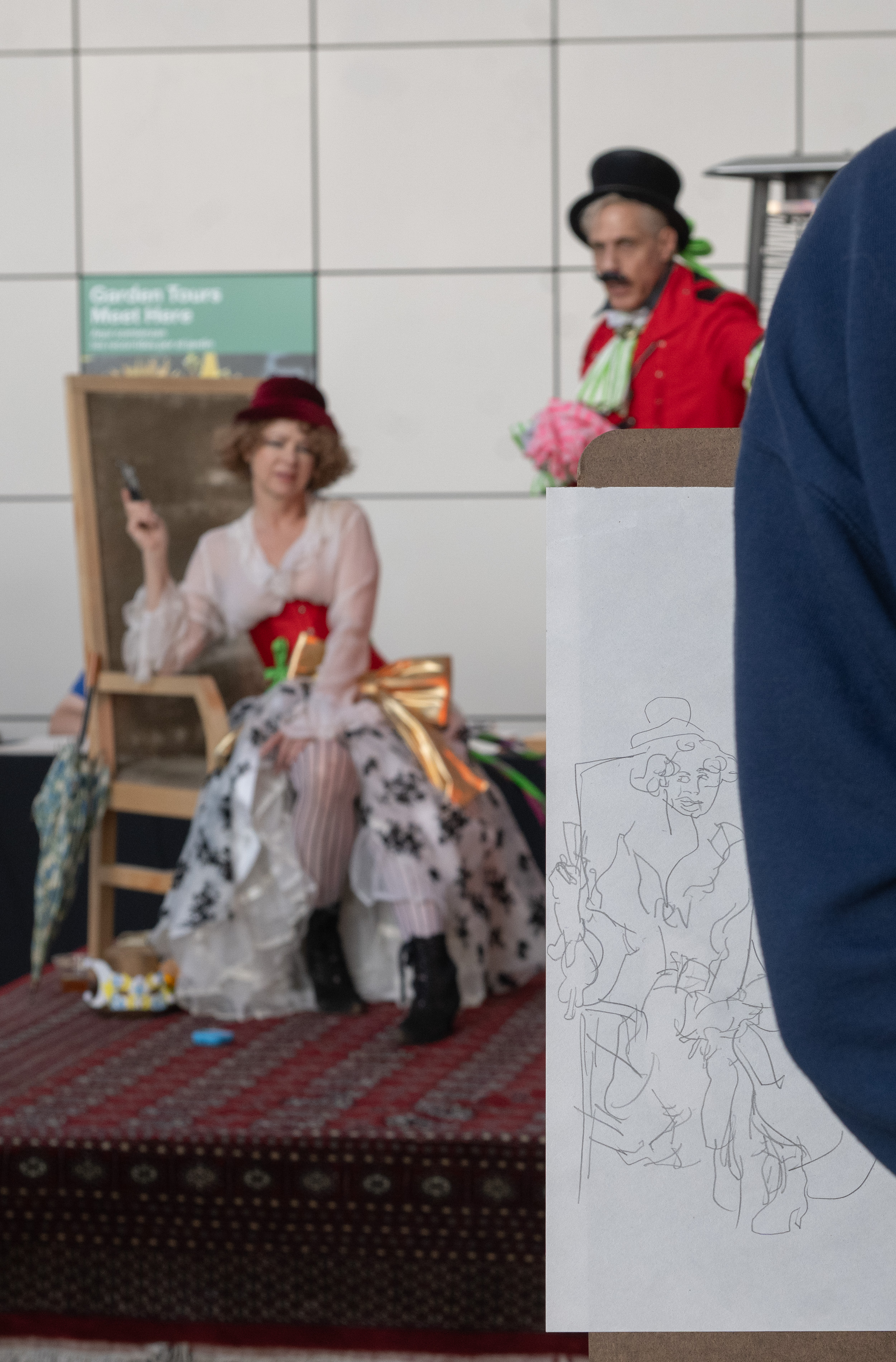 A drawing demonstration with two art models. With April being "Earth Month," this year&squot;s college night&squot;s theme was sustainability, featuring activities that encouraged attendees to work with upcycled materials. (Leydi Cris Cobo Cordon/Daily Bruin senior staff)