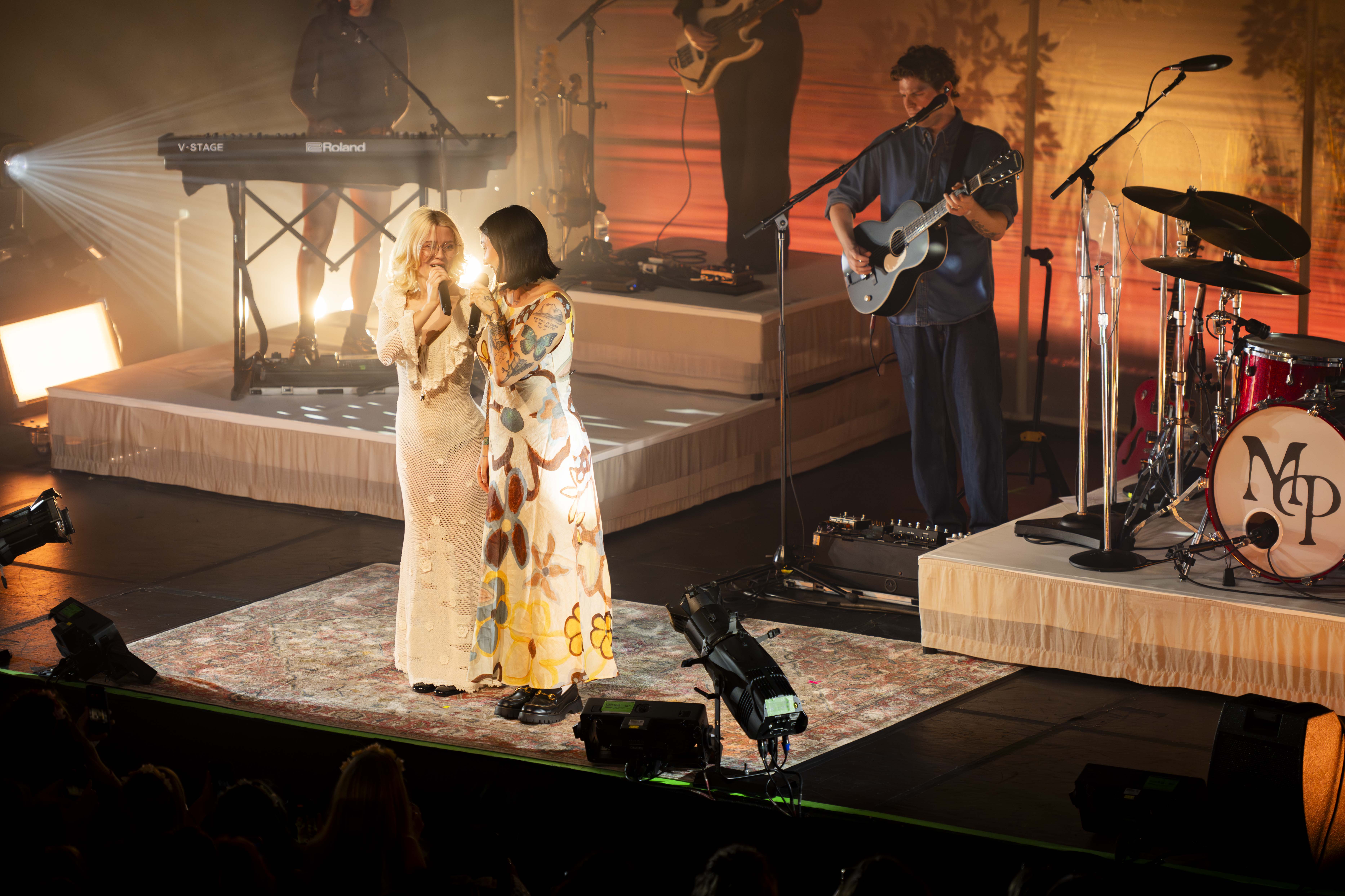 Standing side-by-side are singer-songwriter Julia Michaels and Peters. Michaels joined Peters on stage to perform their recently released collaboration "Kingmaker." (Bettina Wu/Assistant Photo editor)