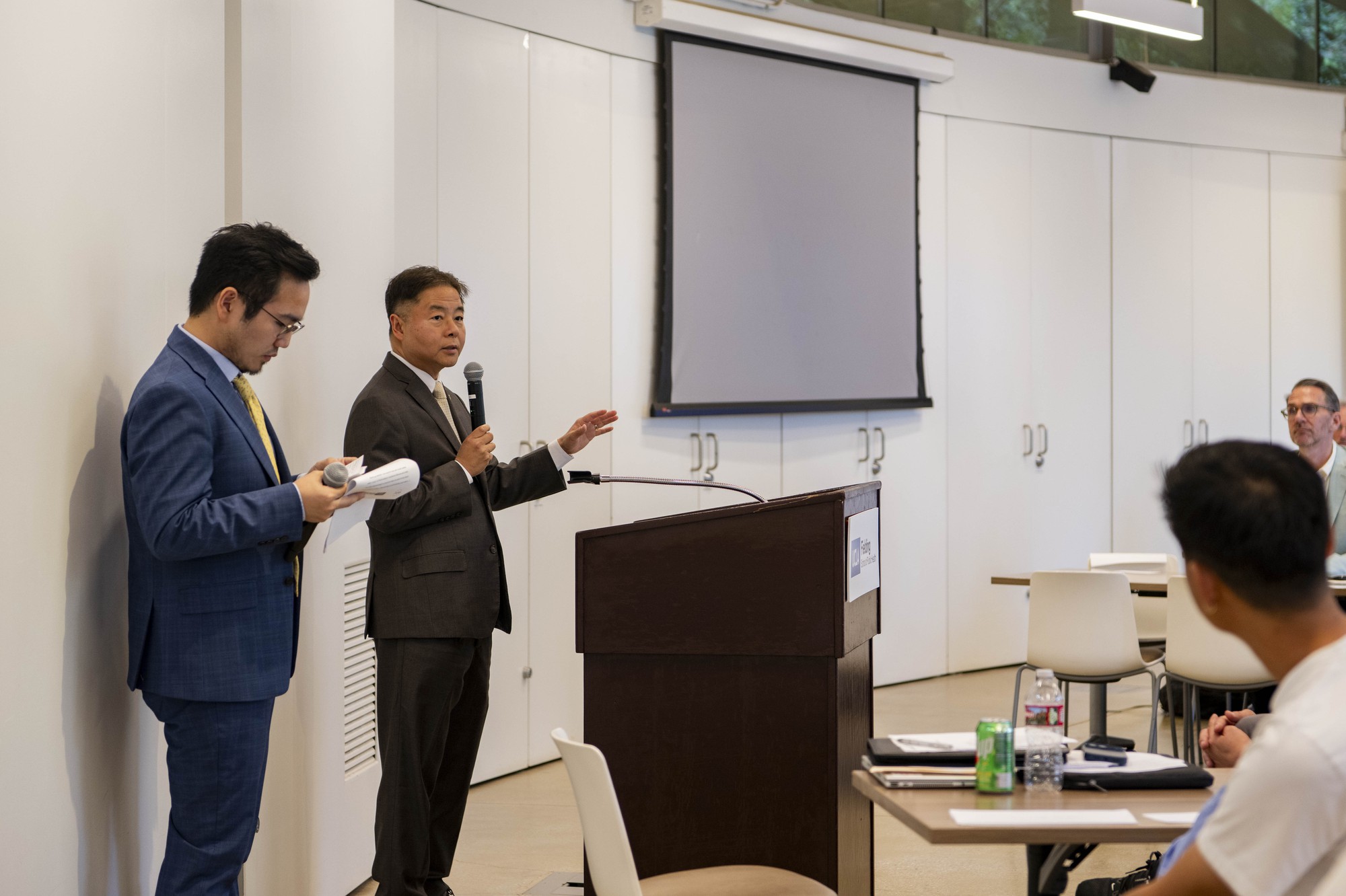 U.S. Representative Ted Lieu and Jack Feng, the vice president of communications for the UCLA Center for LGBTQ+ Advocacy, Research and Health, are pictured speaking to event attendees