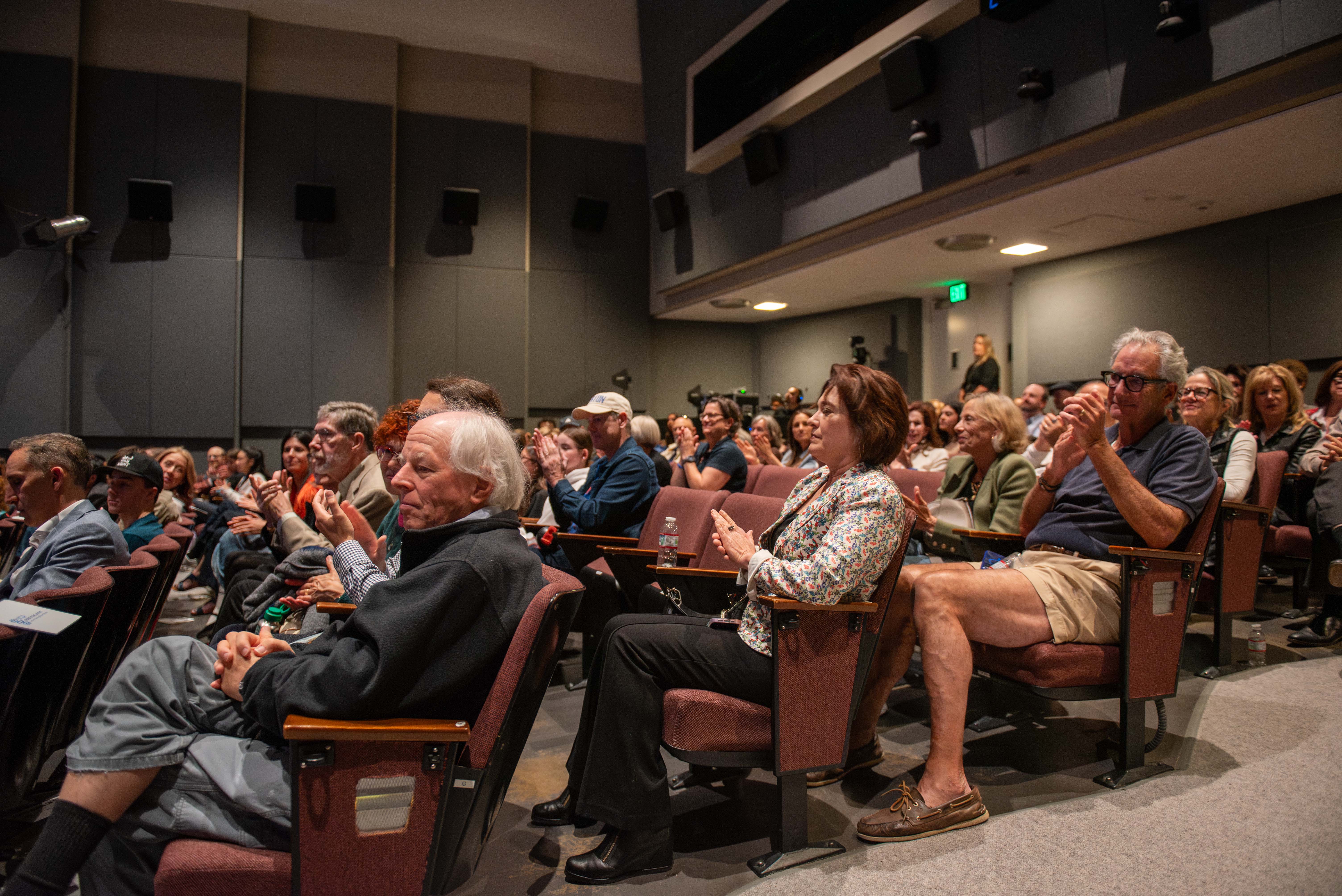 Photo of the audience shows the festival's attendees clapping. The film festival took place on April 26, and brought together high school filmmakers from across the country to raise awareness on topics like anxiety, depression, the impact of social media and eating disorders.(Pranav Akella/Daily Bruin)