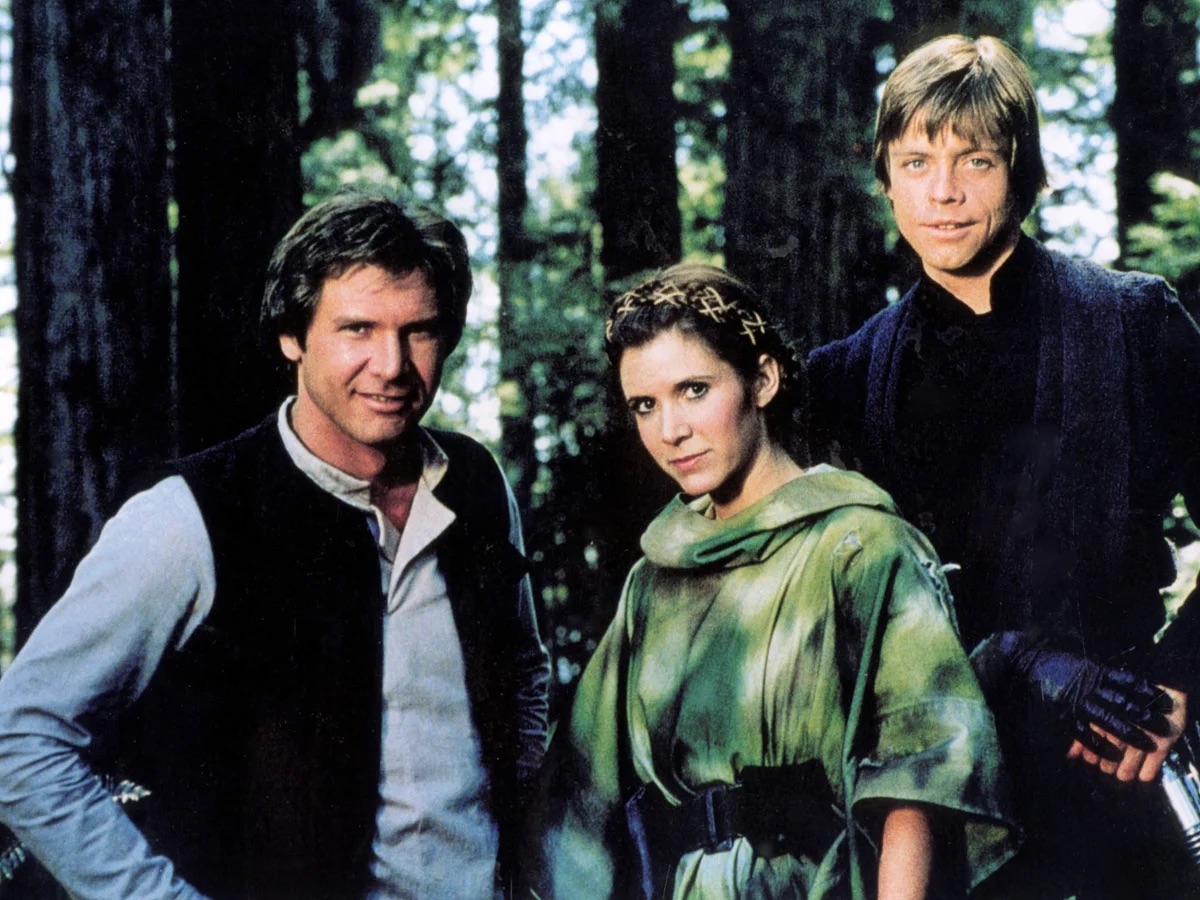 Ford, Fisher and Hamill (left to right) unite again to play Han Solo, Princess Leia and Luke Skywalker in “Star Wars: Episode VI - Return of the Jedi.” The original series finale, the film debuted in 1983. (Courtesy of LucasFilms/Allstar)
