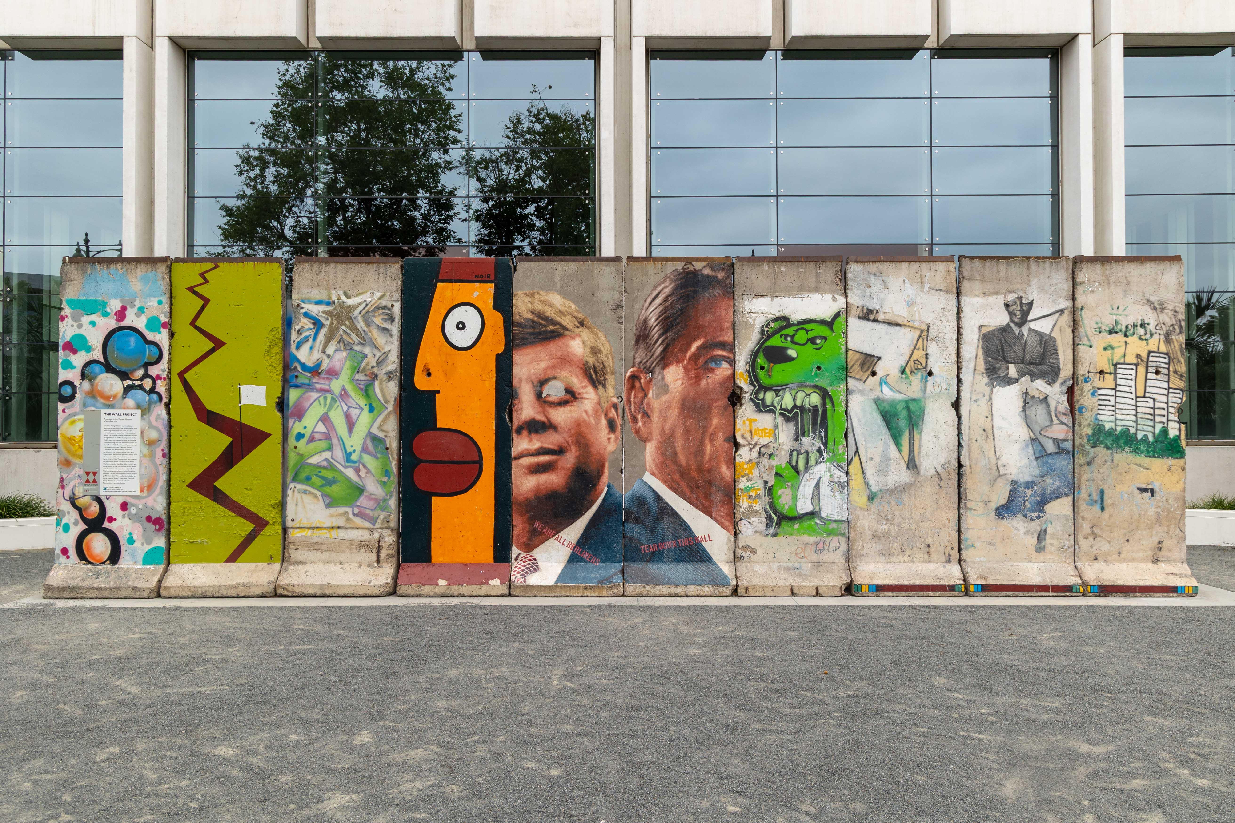 A wall of pop-art stands out against a mirrored background. The excursion around LA is limited by participants remaining inside the tour bus. (Chenrui Zhang/Daily Bruin staff)