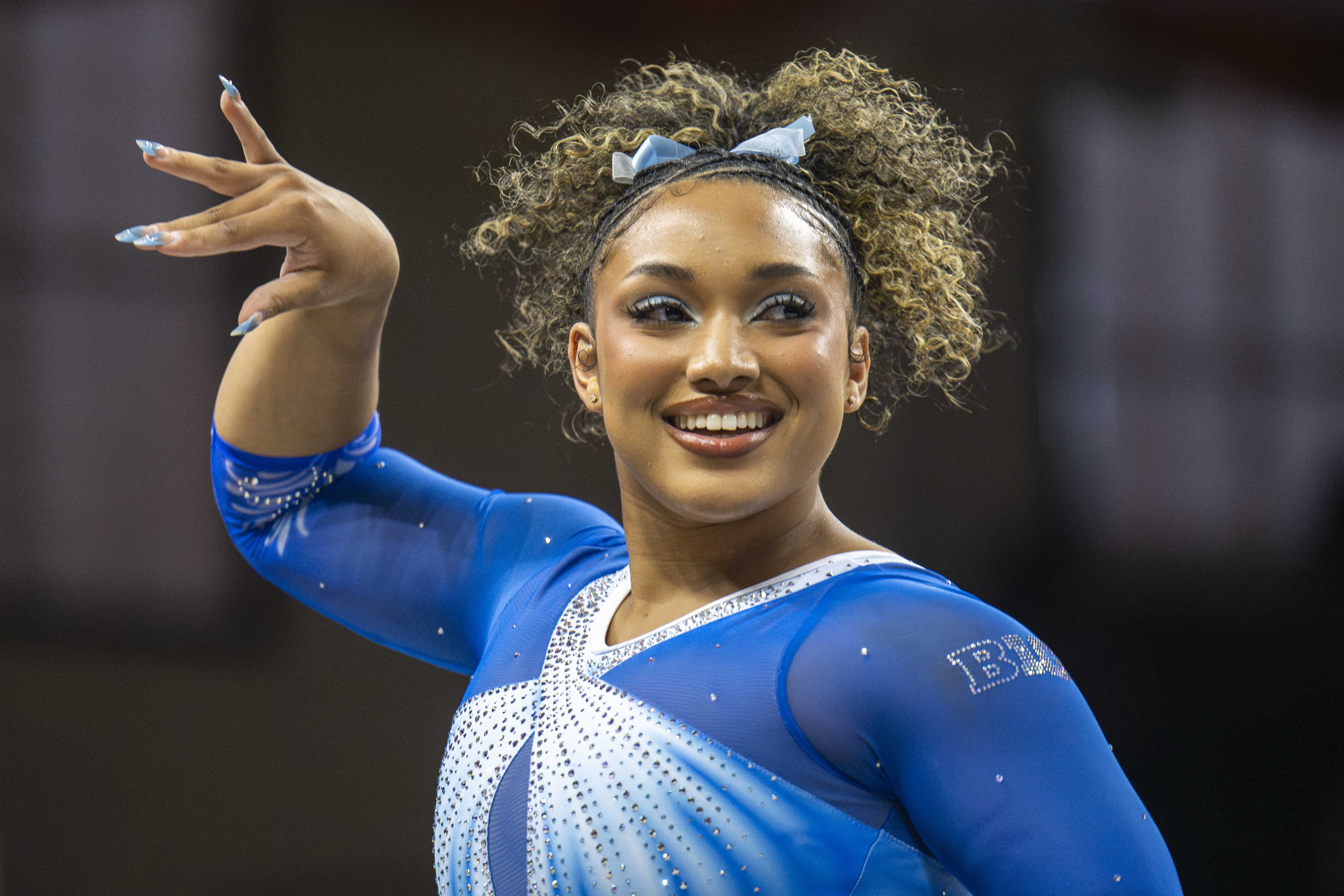 Junior Sydney Barros dances during her floor routine. She earned four scores of 9.900 throughout the season. (Andrew Diaz/Photo editor)