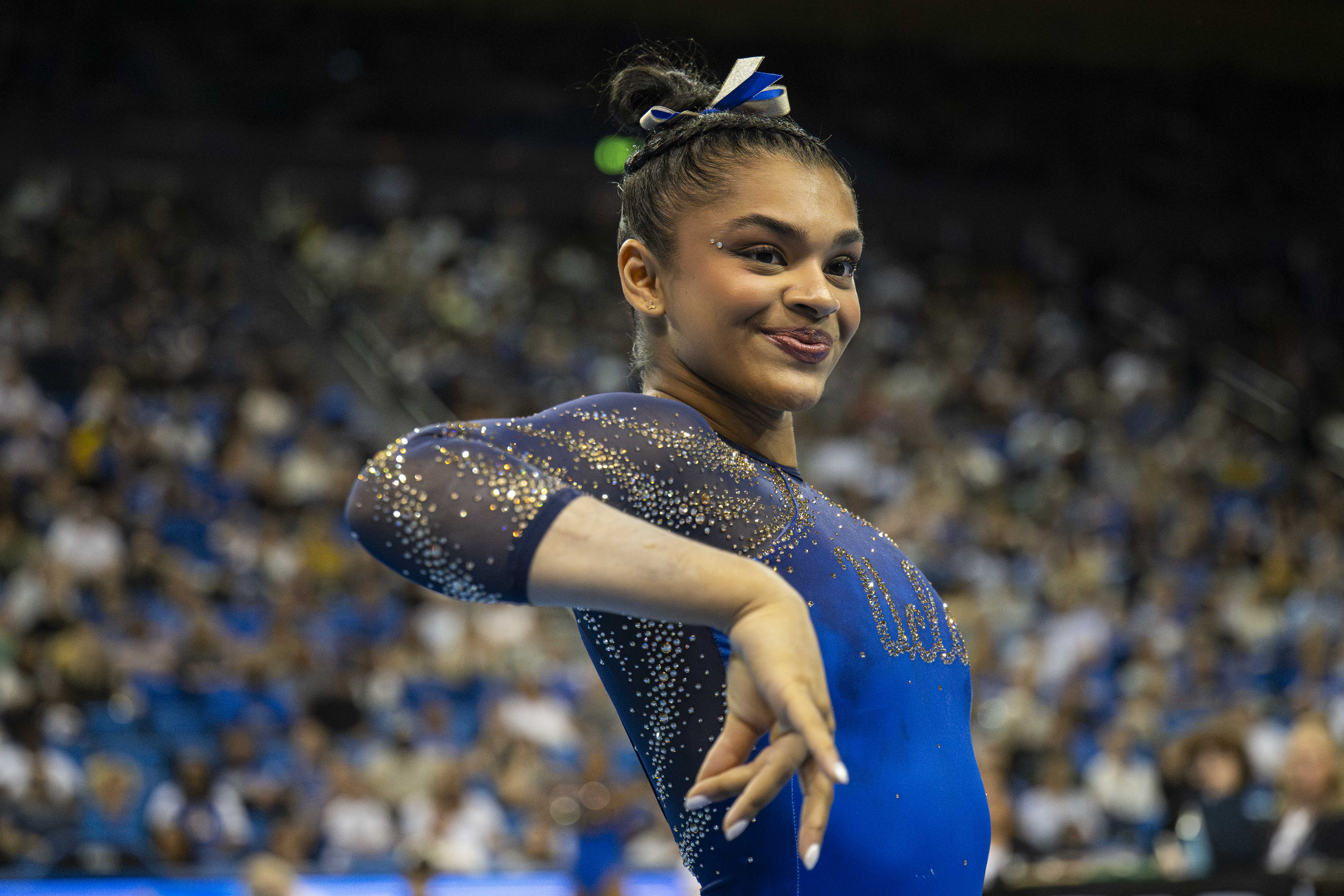 Freshman Tiana Sumanasekera dances during her floor routine. Her routine features Sri Lankan-inspired choreography. (Crystal Tompkins/Daily Bruin senior staff)
