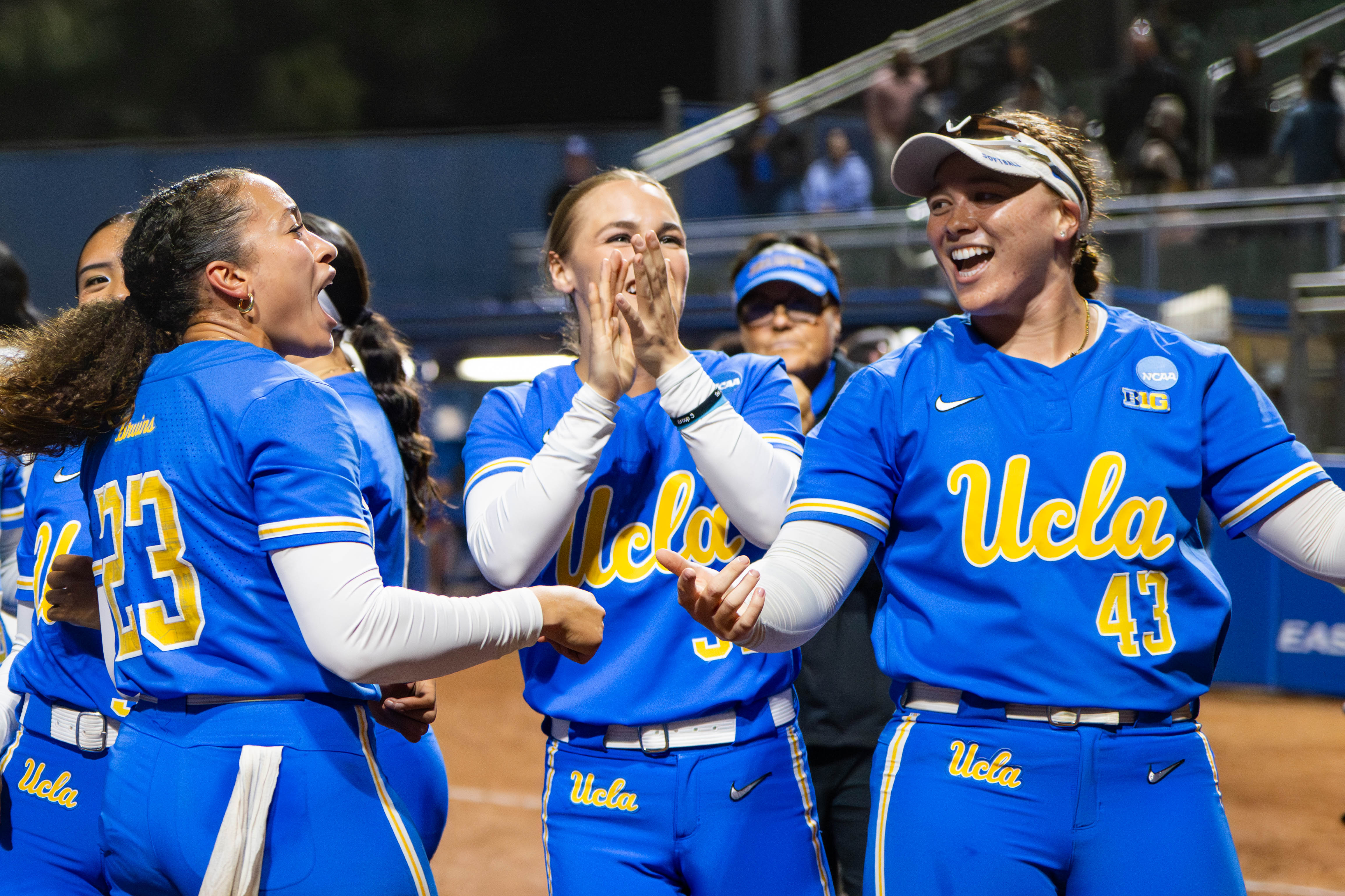 Left to right: Senior pitcher Taylor Tinsley, redshirt junior designated player/infielder Ramsey Suarez and senior utility Megan Grant celebrate the Bruins' Los Angeles Super Regional triumph Saturday. The Westwood squad clinched its third straight Women's College World Series appearance. (Brianna Carlson/Daily Bruin staff)