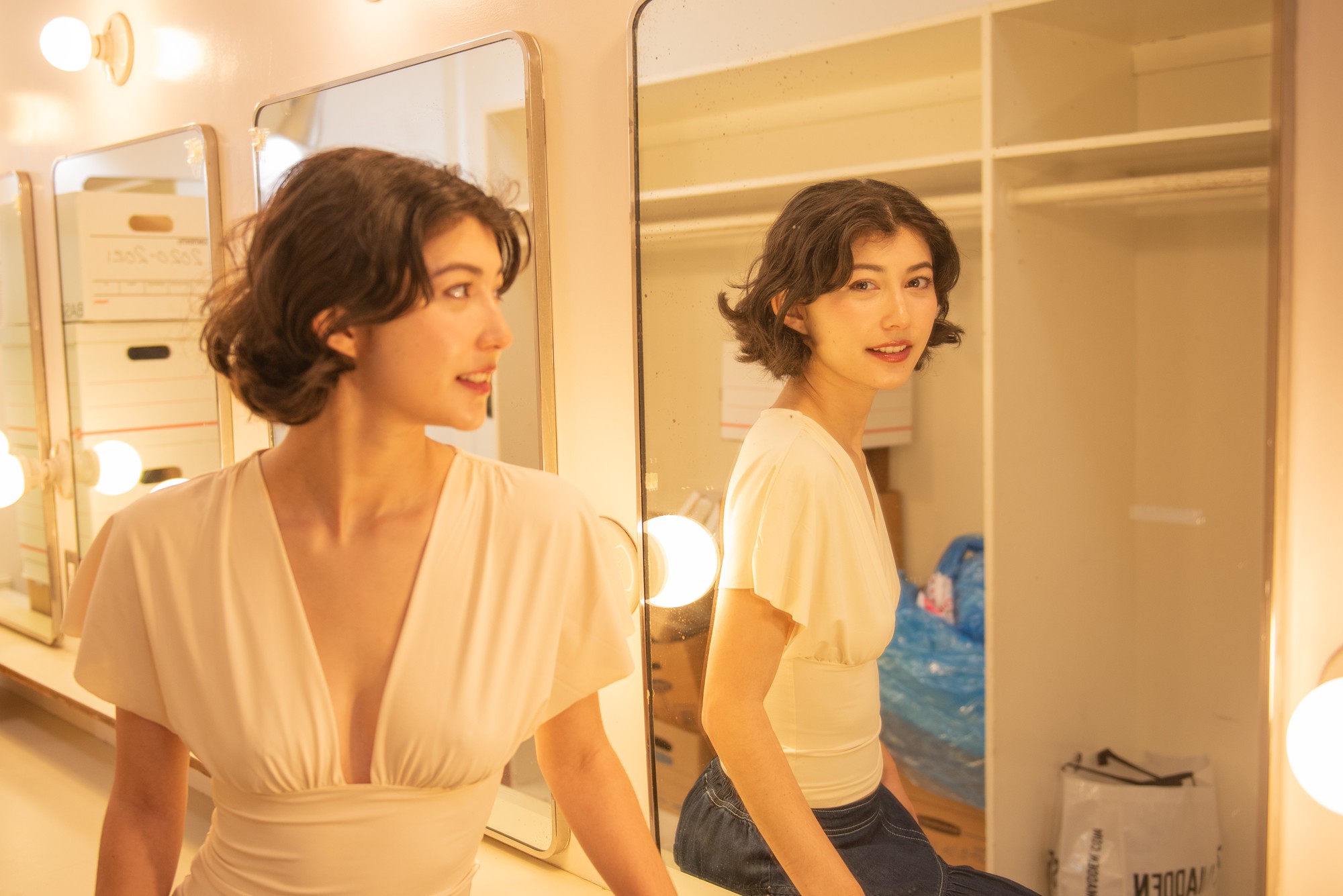 Hedican looks at herself in a mirror. She said the support from her professors and peers has helped her combat imposter syndrome and trust her own voice. (Chenrui Zhang/Daily Bruin staff)