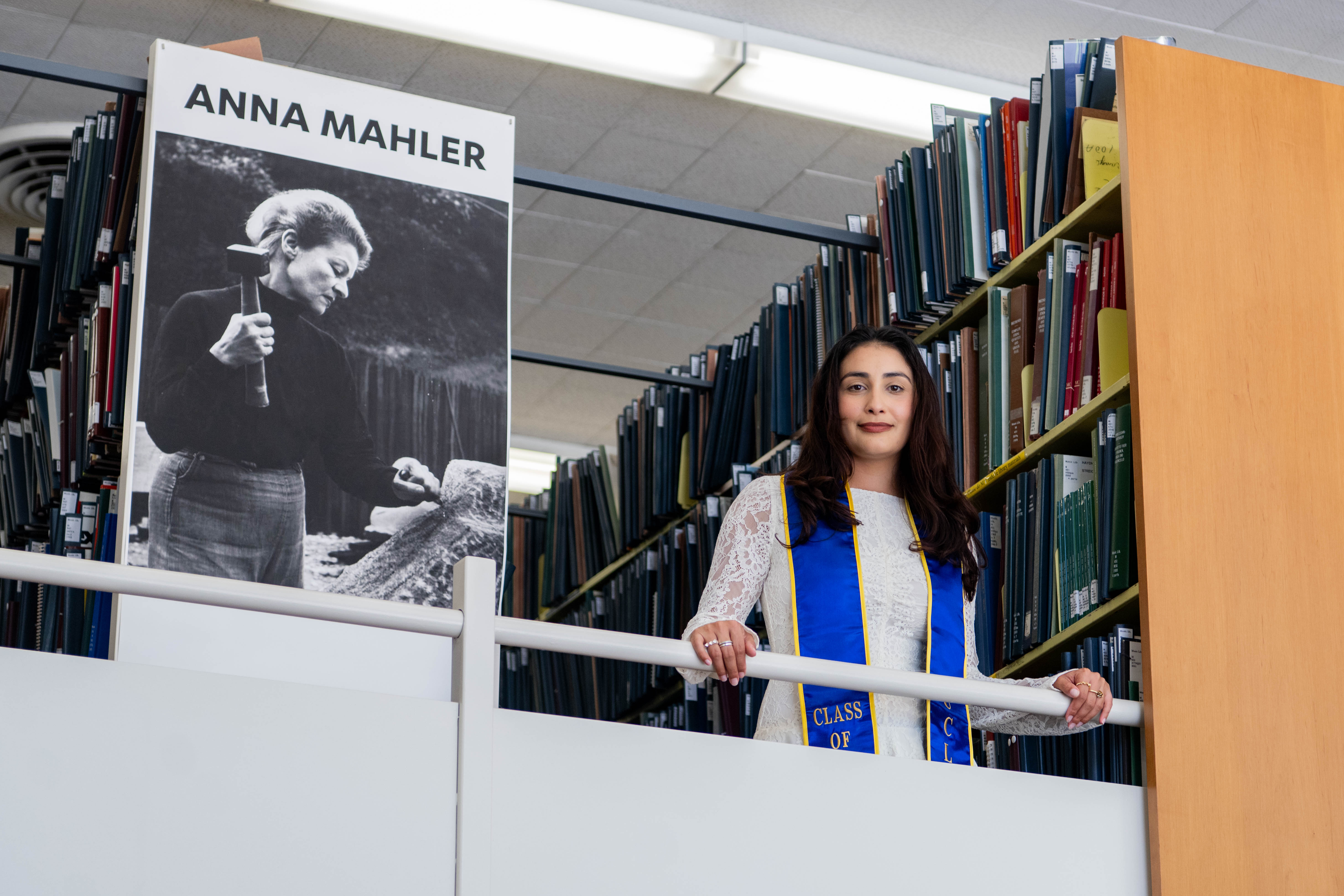 Robles stands atop a ledge in the Music Library at UCLA. She said Backstage Pass, her senior year capstone project, was created to educate students on the different jobs in live music. (Andrew Ramiro Diaz/Photo editor)
