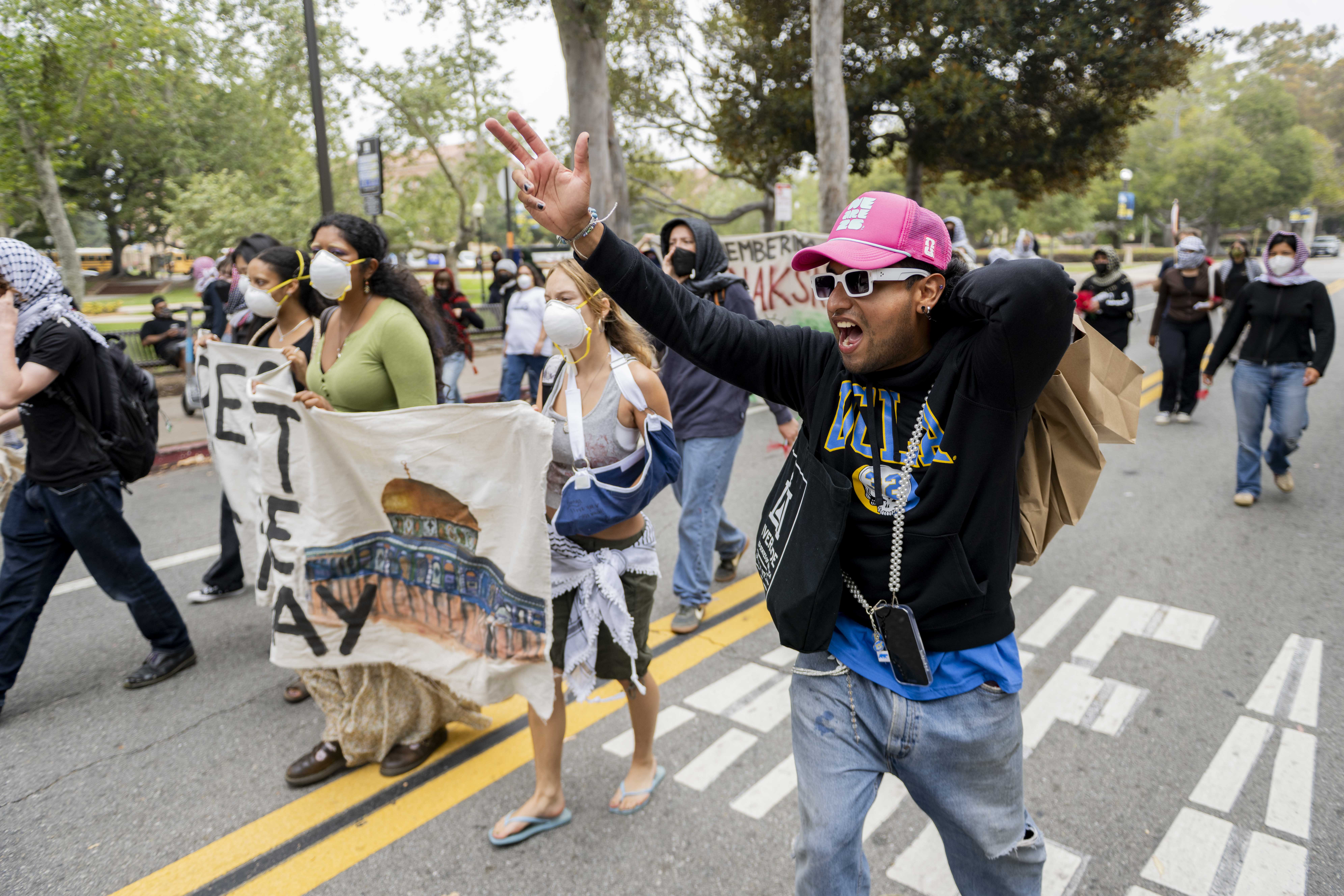 Demonstrators march on the street. Protesters carried banners reading “Remember Al-Naksa” and chanted, “What we want is total freedom” throughout the noon rally. (Andrew Ramiro Diaz/Photo editor)