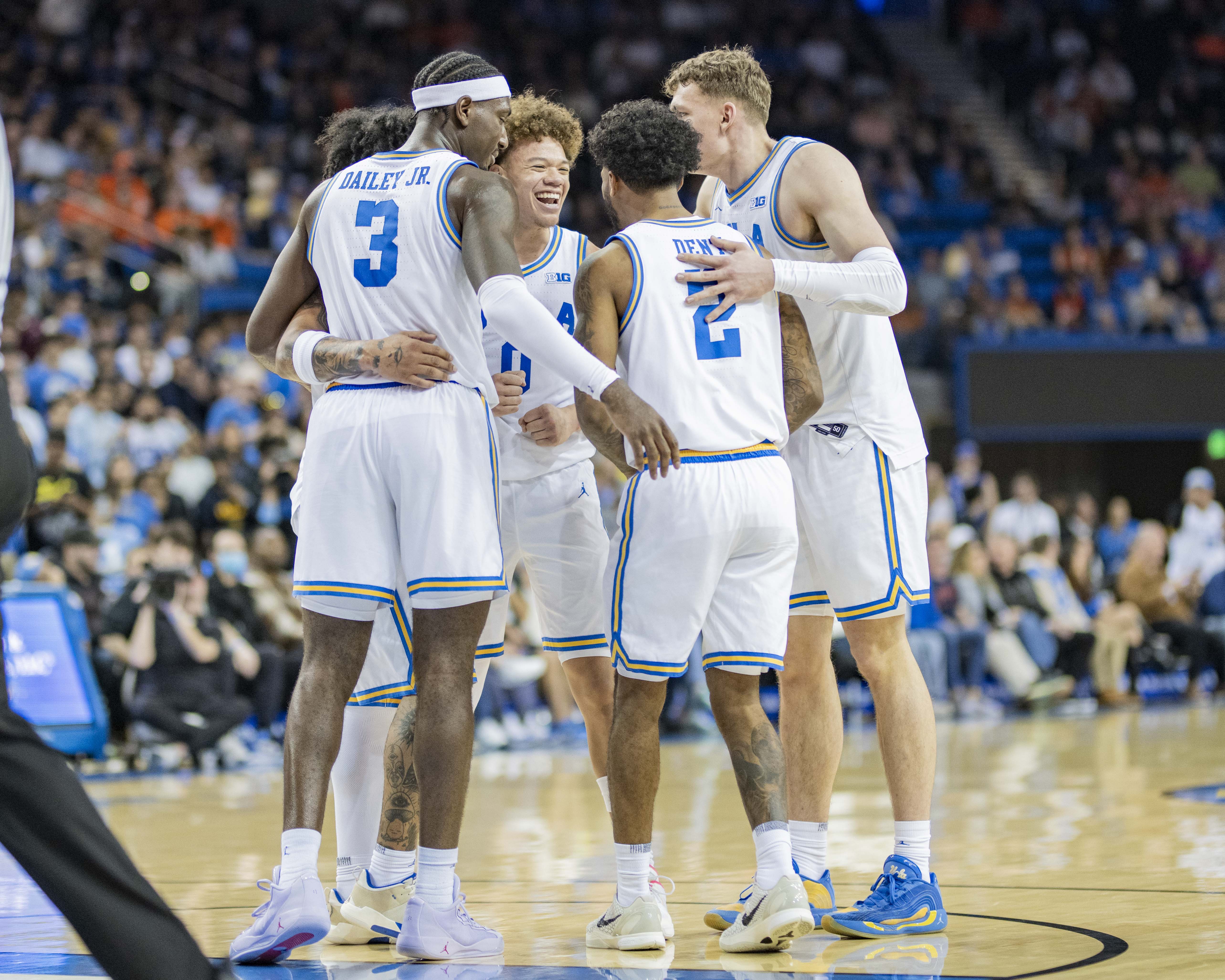 UCLA men's basketball players stand in a huddle. The Bruins finished the 2025-26 season with a 24-12 record, including just one loss at home. (Aidan Sun/Daily Bruin senior staff)