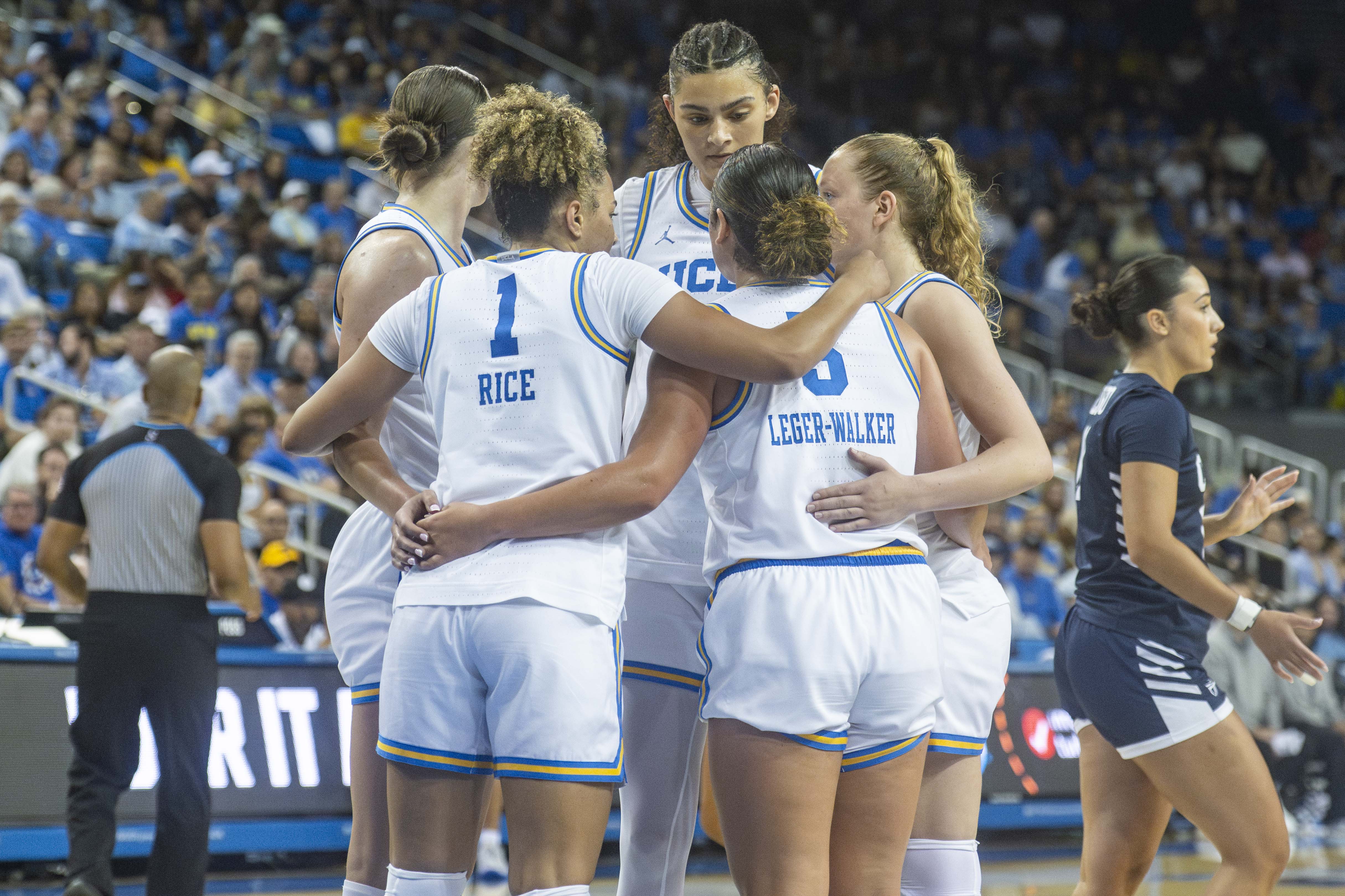 UCLA women's basketball players stand together in a huddle. The Bruins saw six players drafted to the WNBA in 2026. (Leydi Cris Cobo Cordon/Daily Bruin senior staff)