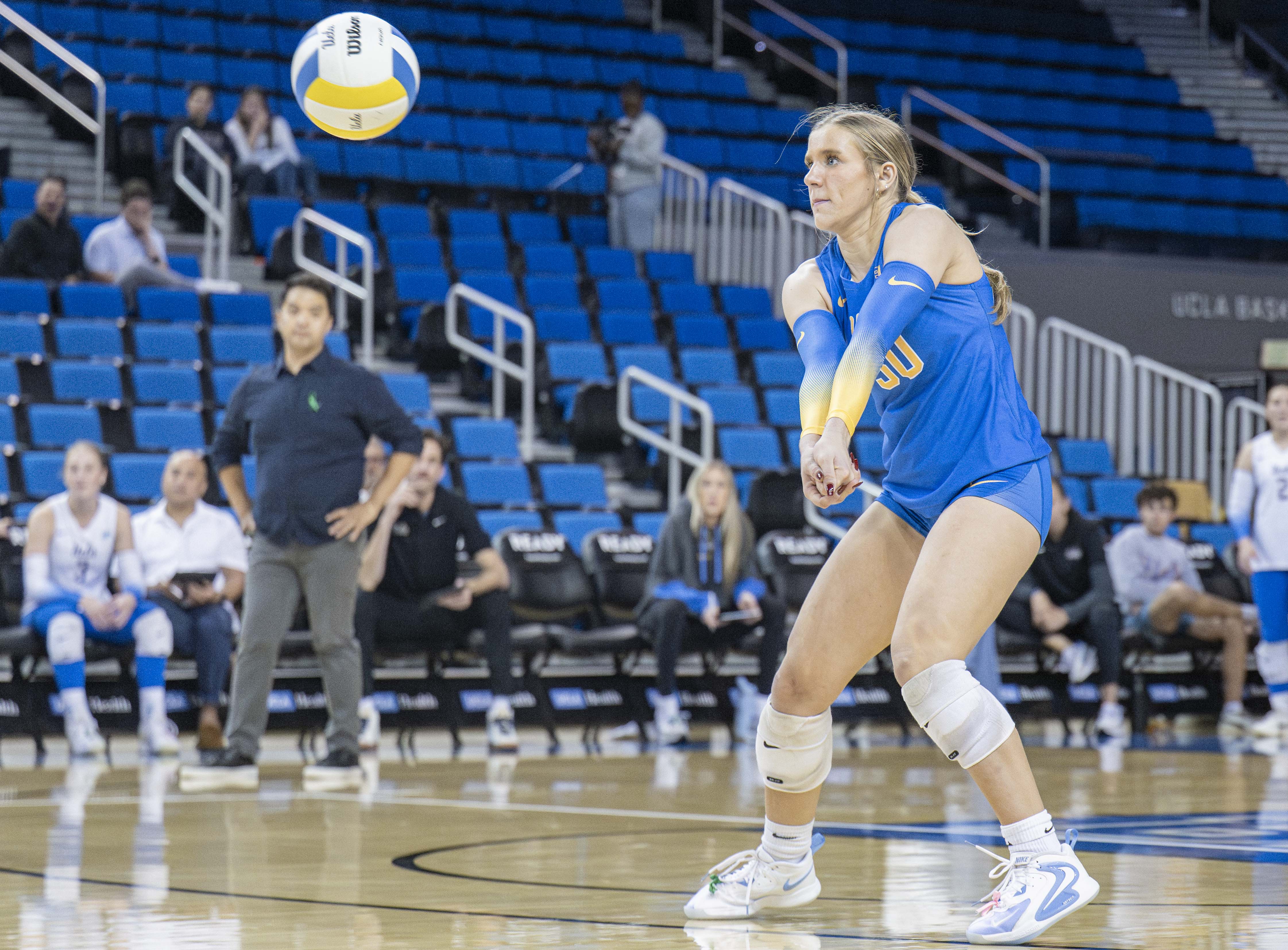 Sophomore libero Lola Schumacher prepares to receive the ball. Schumacher joined UCLA women's volleyball after one season at Wisconsin. (Ruby Galbraith/Daily Bruin staff)