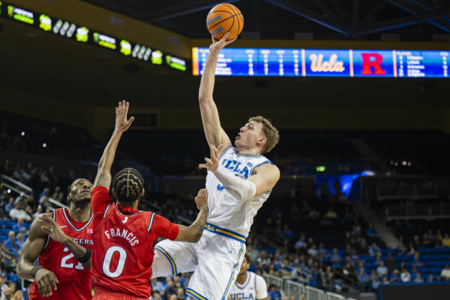 Forward Tyler Bilodeau attempts a floater over an opposing defender. Bilodeau was drafted 43rd overall by the Brooklyn Nets following two seasons at UCLA. (Zimo Li/Daily Bruin senior staff)