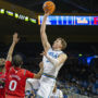Forward Tyler Bilodeau attempts a floater over an opposing defender. Bilodeau was drafted 43rd overall by the Brooklyn Nets following two seasons at UCLA. (Zimo Li/Daily Bruin senior staff)