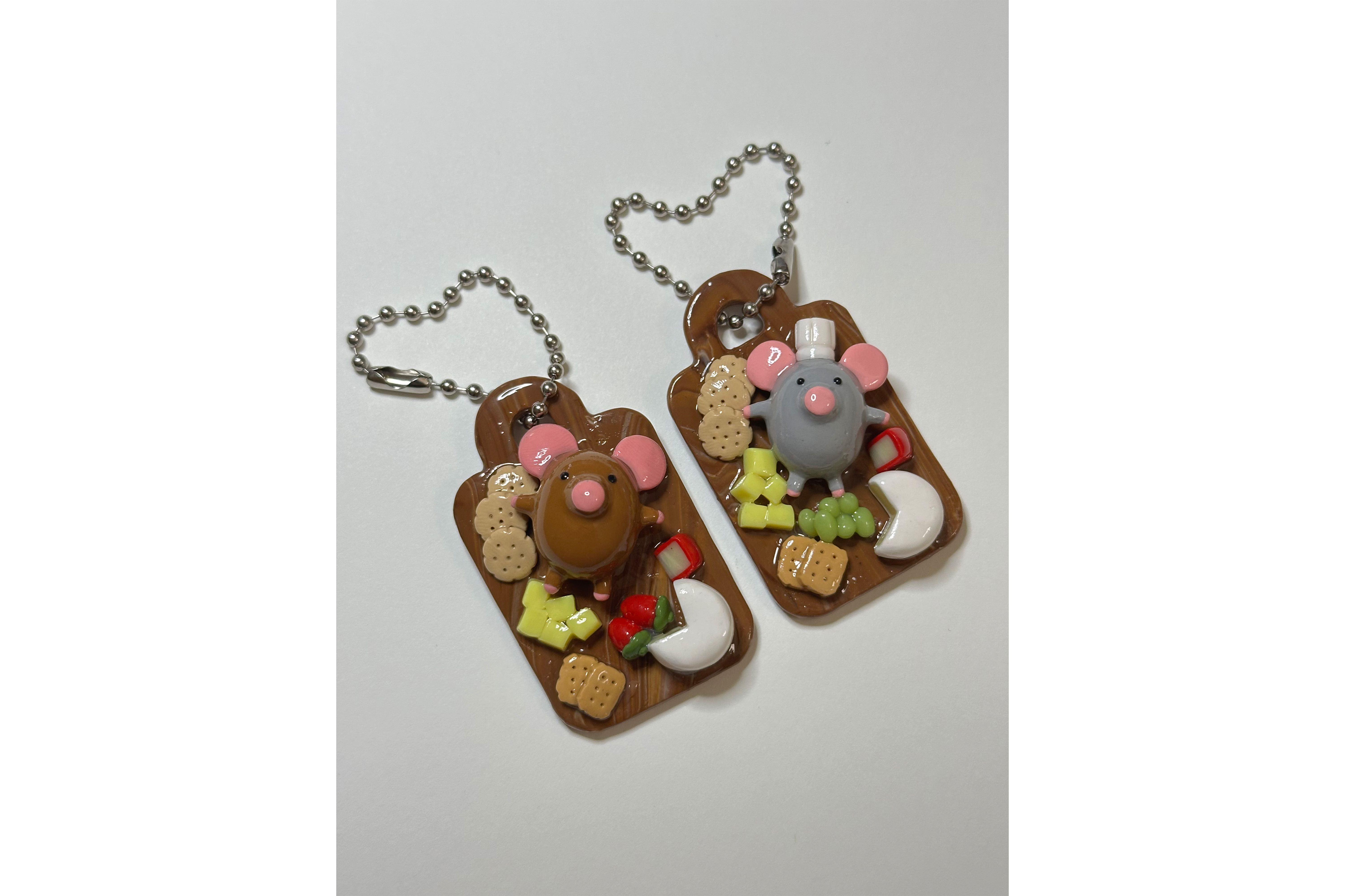 Two Critter Trinkets keychains are pictured. Donna Wu creates and sells clay art pieces, ranging from pins and magnets to hair clips, keychains and more. (Courtesy of Donna Wu. Cropped from original)