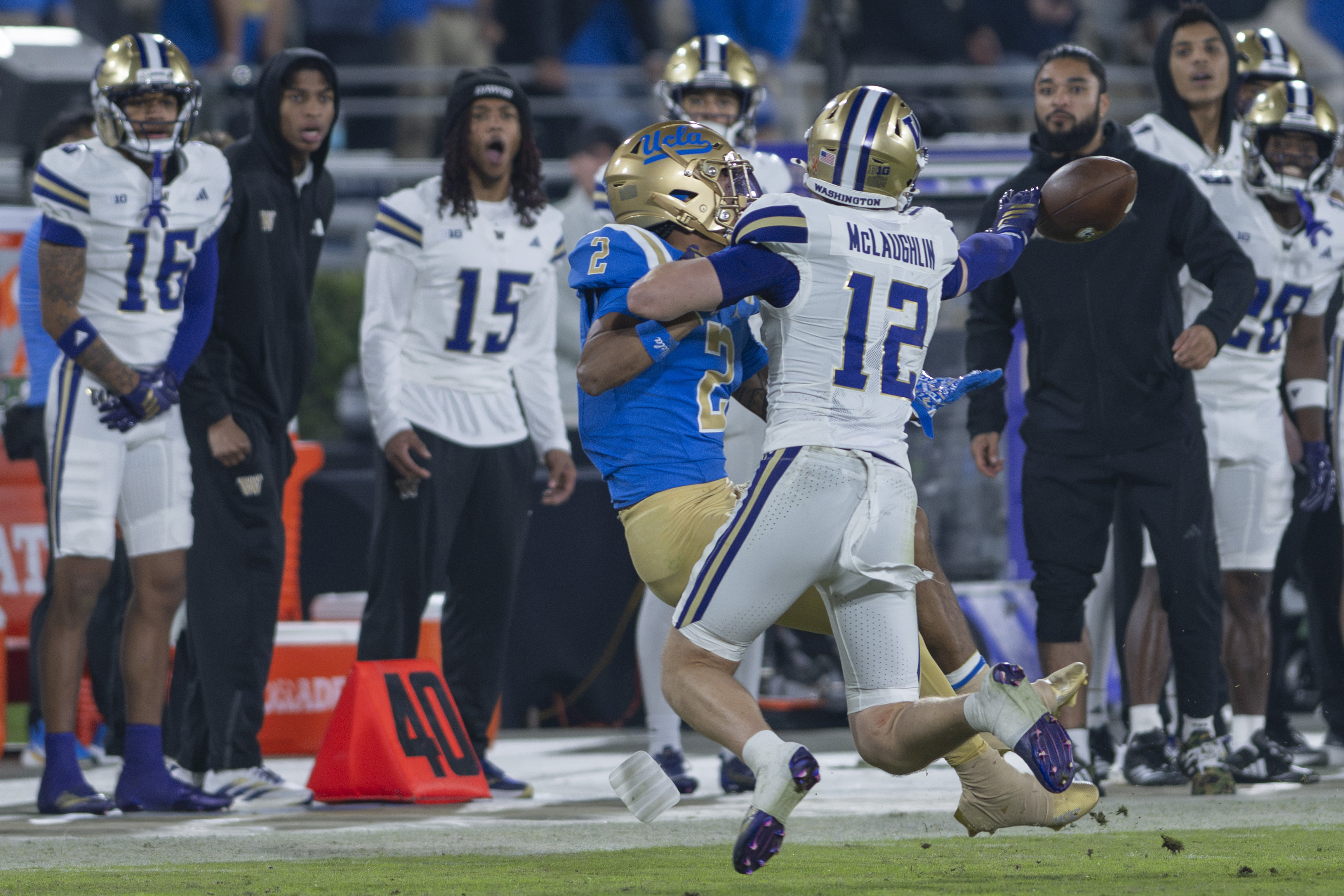 Senior safety Alex McLaughlin pushes past a Bruin to knock down a pass. McLaughlin had eight tackles against UCLA, five of which were solo. (Michael Gallagher/Daily Bruin senior staff)