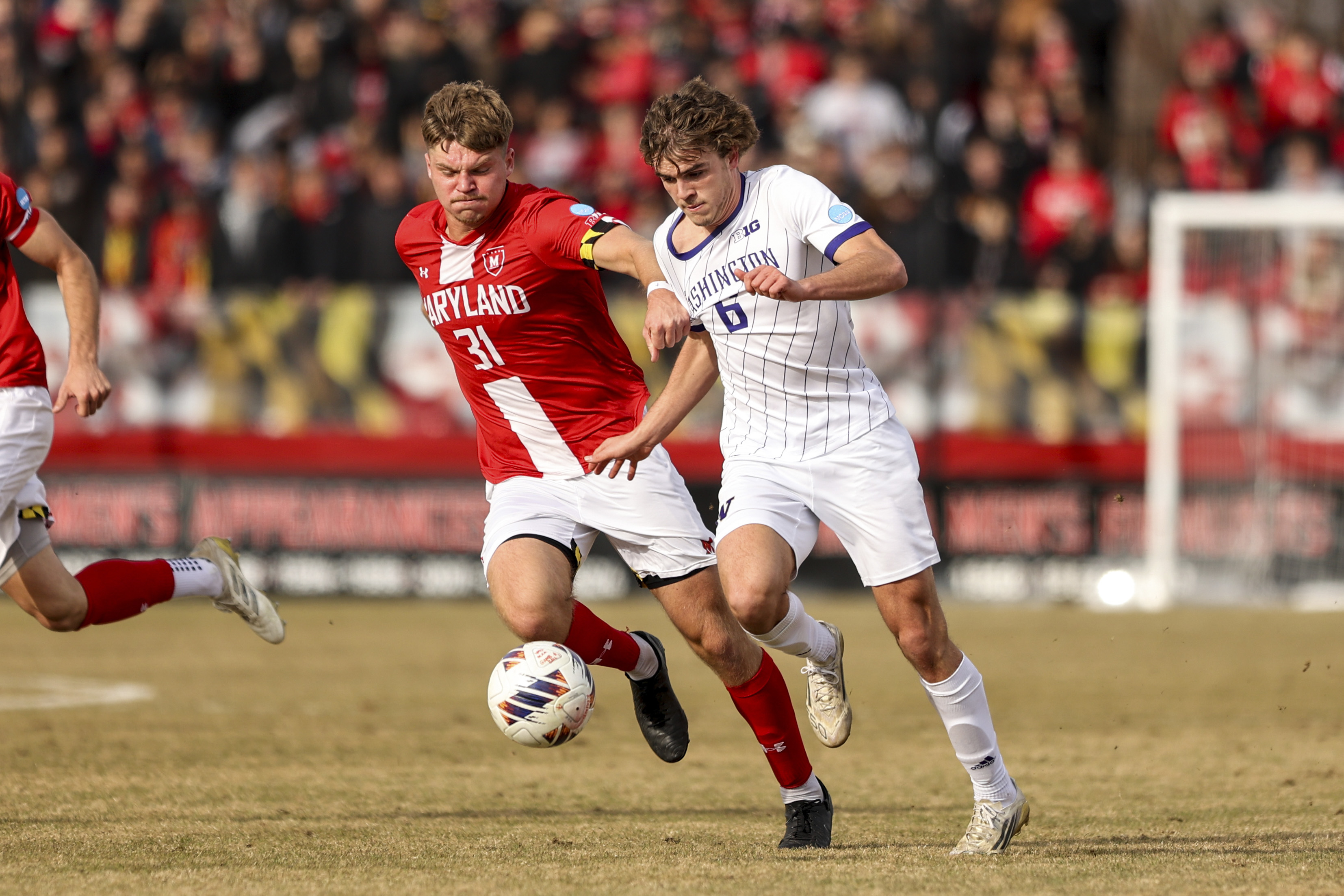 Rising junior midfielder Zach Ramsey dribbles by an opposing player. Ramsey scored eight goals across appearances in all 24 games. (Courtesy of Washington Athletics)
