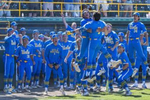 UCLA baseball celebrates in front of its dugout after a home run. With a flurry of draft-eligible juniors and seniors, the 2027 Bruins may look very different from their 2026 rendition. (Kai Dizon/Assistant Photo editor)