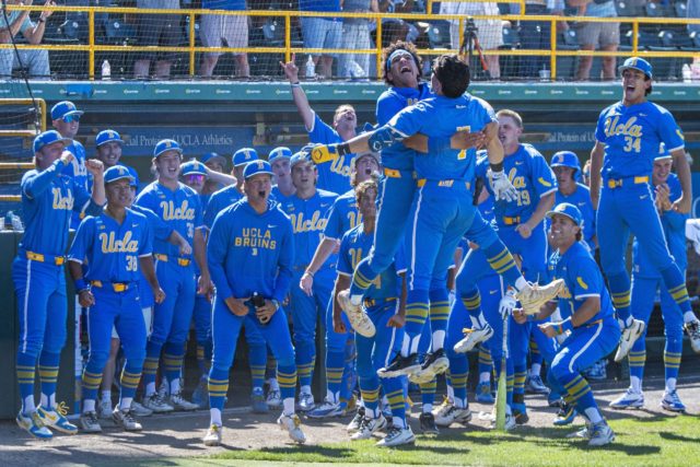 UCLA baseball celebrates in front of its dugout after a home run. With a flurry of draft-eligible juniors and seniors, the 2027 Bruins may look very different from their 2026 rendition. (Kai Dizon/Assistant Photo editor)