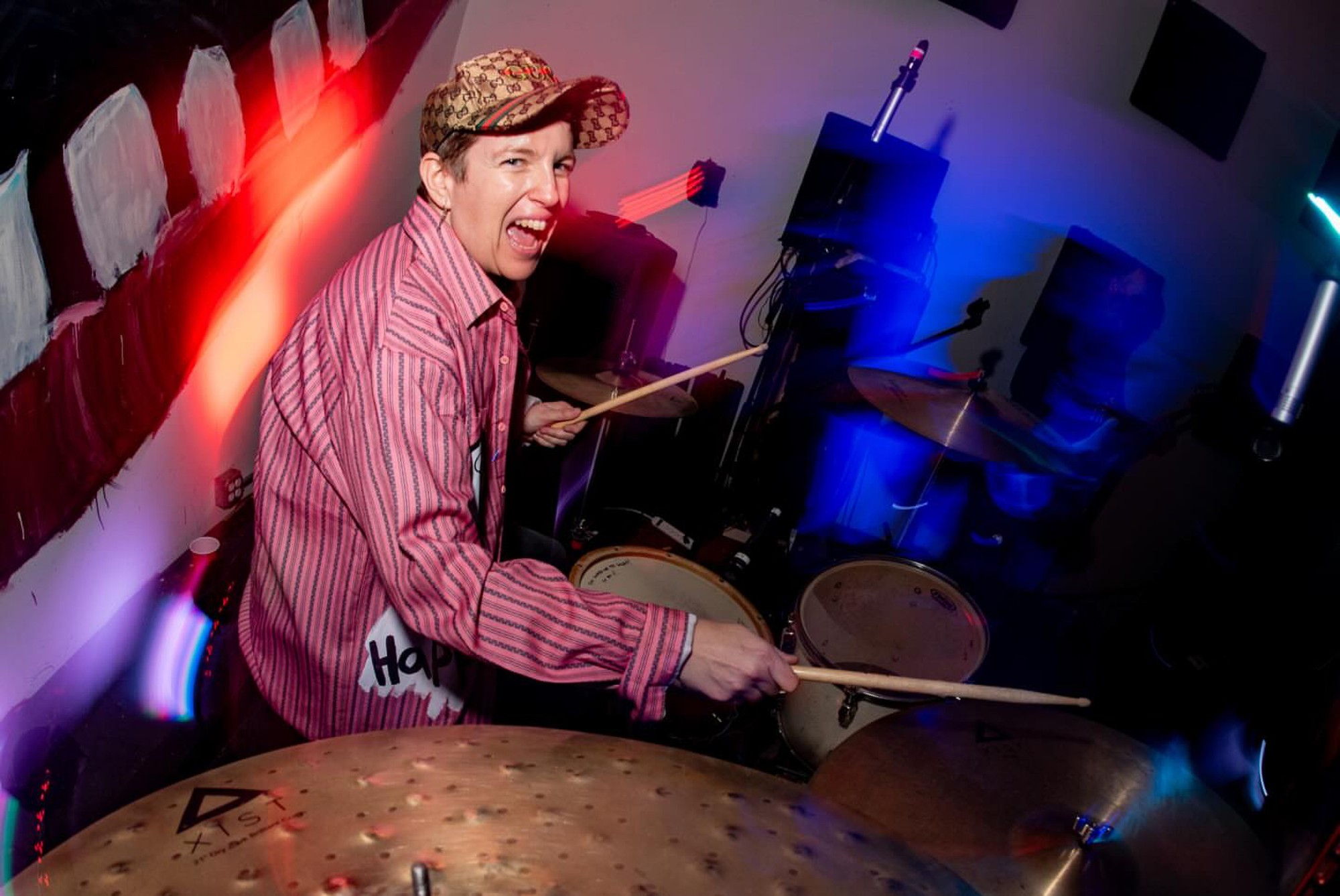 Hansen sits at the drums looking into the camera. The artist has spent the past decade drumming for punk pioneer Alice Bag, with the band now preparing for its final performances. (Courtesy of Albert Licano)