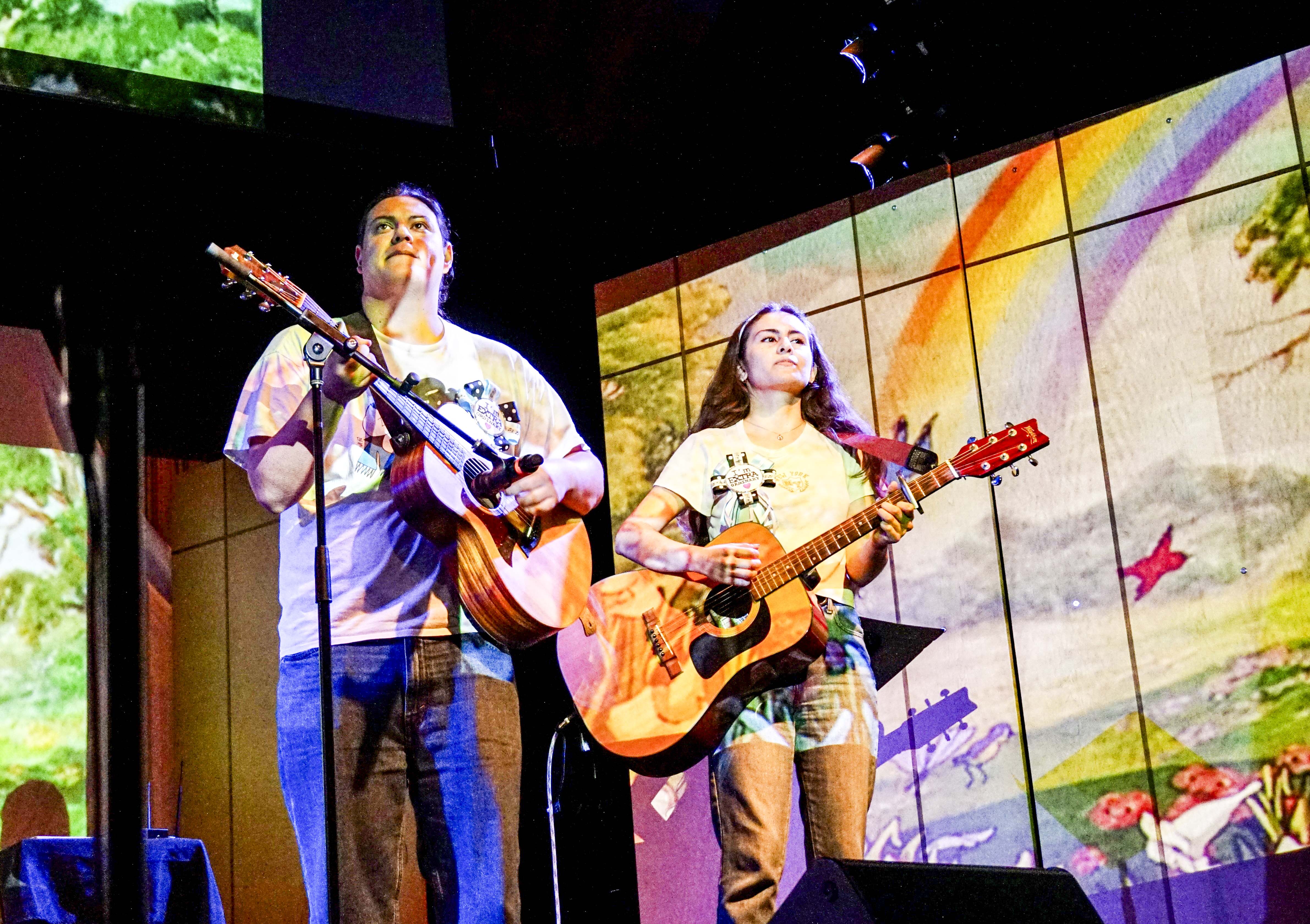 Pictured are the artist's collaborators onstage with guitars. The artist said she originally planned to write, record, mix and master the project herself but then realized the scope was too much for a single person, given her limited time. (Courtesy of Moriah Contreras)
