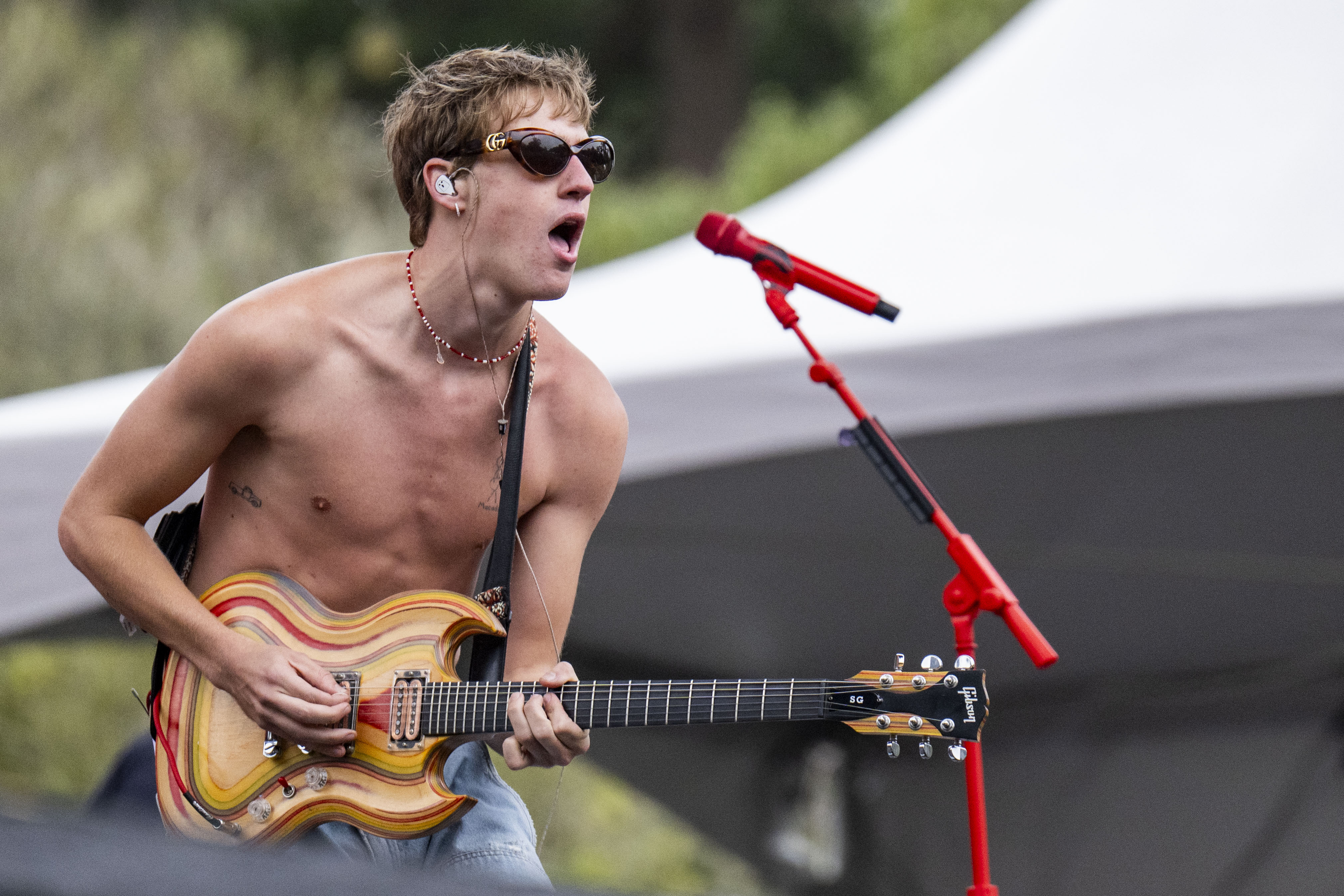 Todd strums a multicolored electric guitar as he sings. The artist performed fan-favorite hits, such as "Roommates," as well as popular covers. (Leydi Cris Cobo Cordon/Daily Bruin senior staff)