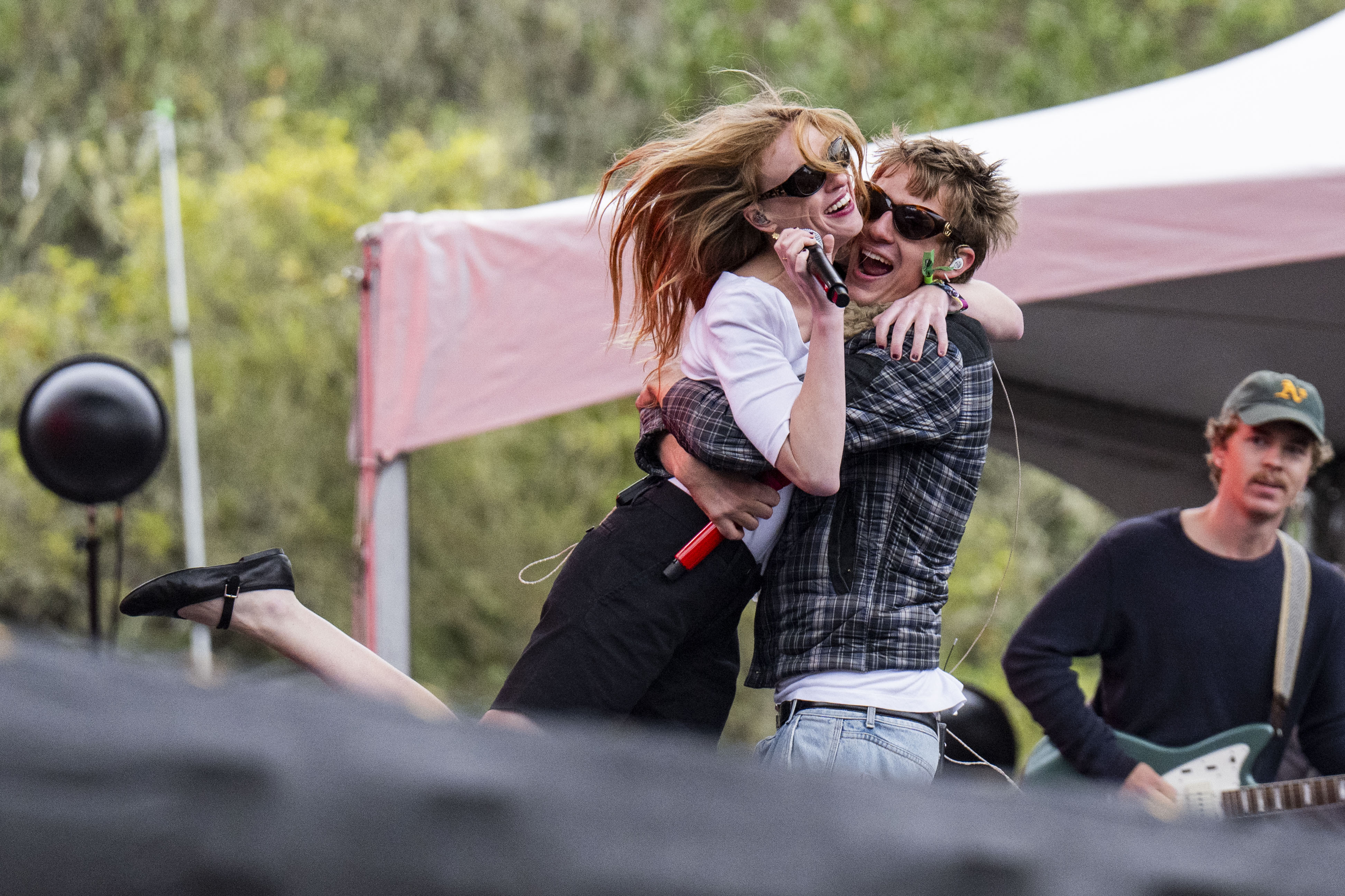 Todd embraces his sister, singer-songwriter Audrey Hobert, on stage. The two performed her song "Phoebe," a track off her 2025 debut album “Who’s the Clown?" (Leydi Cris Cobo Cordon/Daily Bruin senior staff)