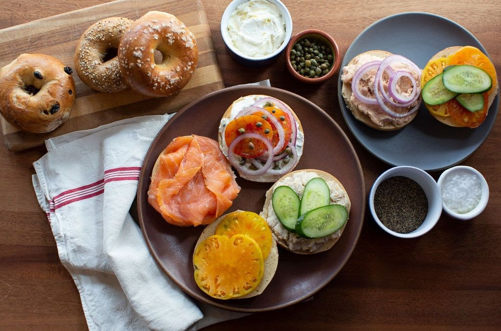 Open-faced bagels from Boichik Bagels are displayed with a variety of topping combinations. The chain first opened in Berkeley and has since been deemed one of the best New York-style bagels by New York Times critic Tejal Rao. (Photo by Lydia Daniller/Boichik Bagels, Courtesy of Eater San Francisco)