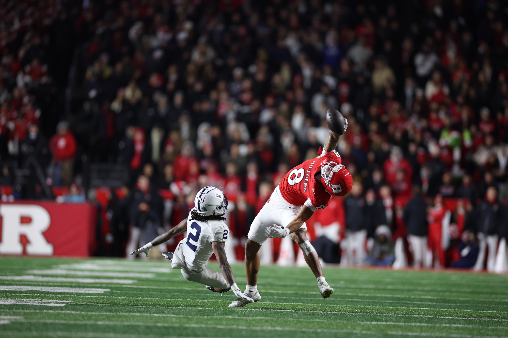 Rutgers wide receiver KJ Duff reaches back for a one-handed catch. Duff was third in the Big Ten last year in total receiving yards with 1,084. (Courtesy of Rutgers University Athletics)