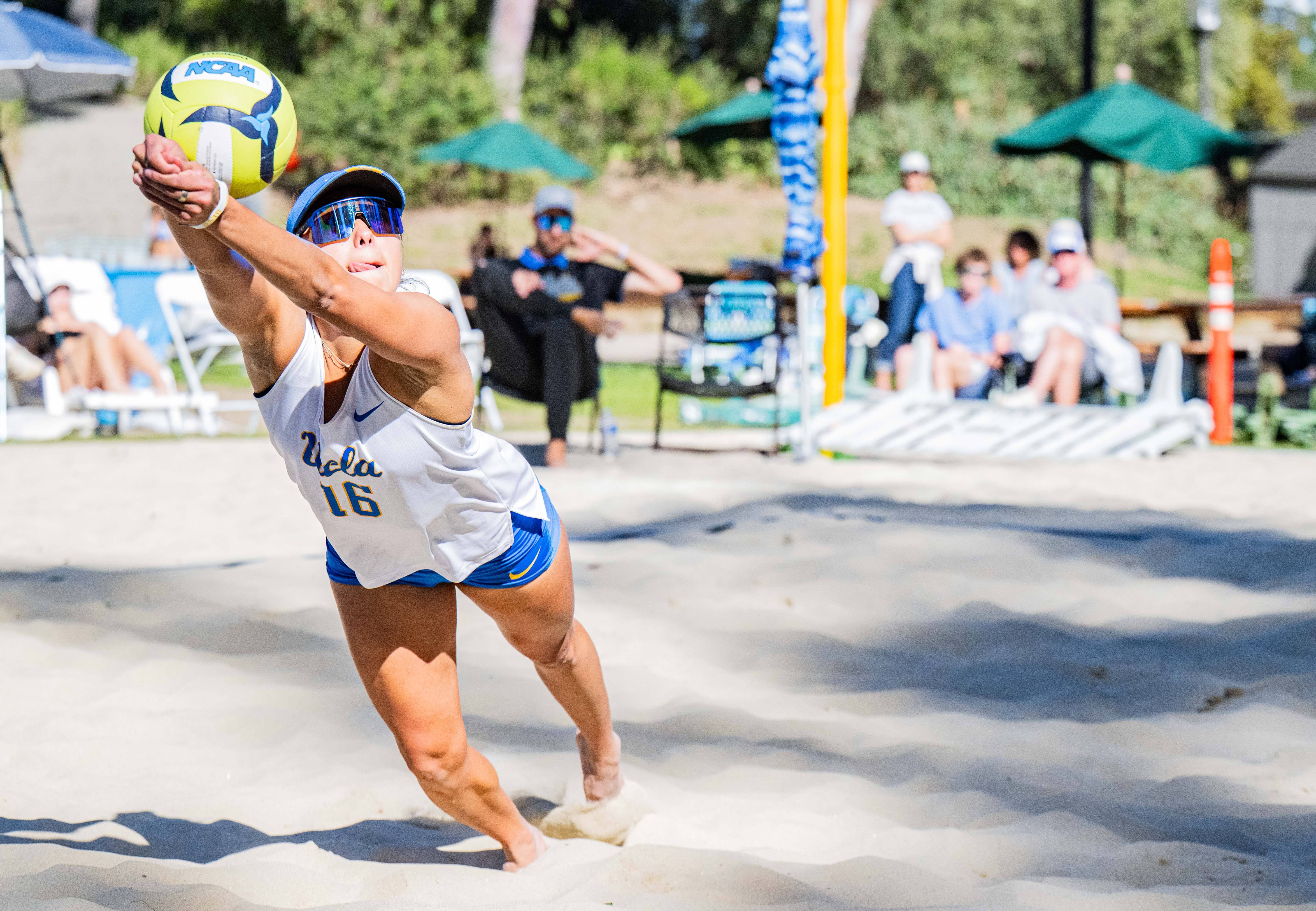 Rising junior Alexa Fernandez dives to receive the ball. Fernandez and her team moved to the MPSF in the 2025 season after UCLA athletics left the Pac-12. (Holden Yung/Daily Bruin)