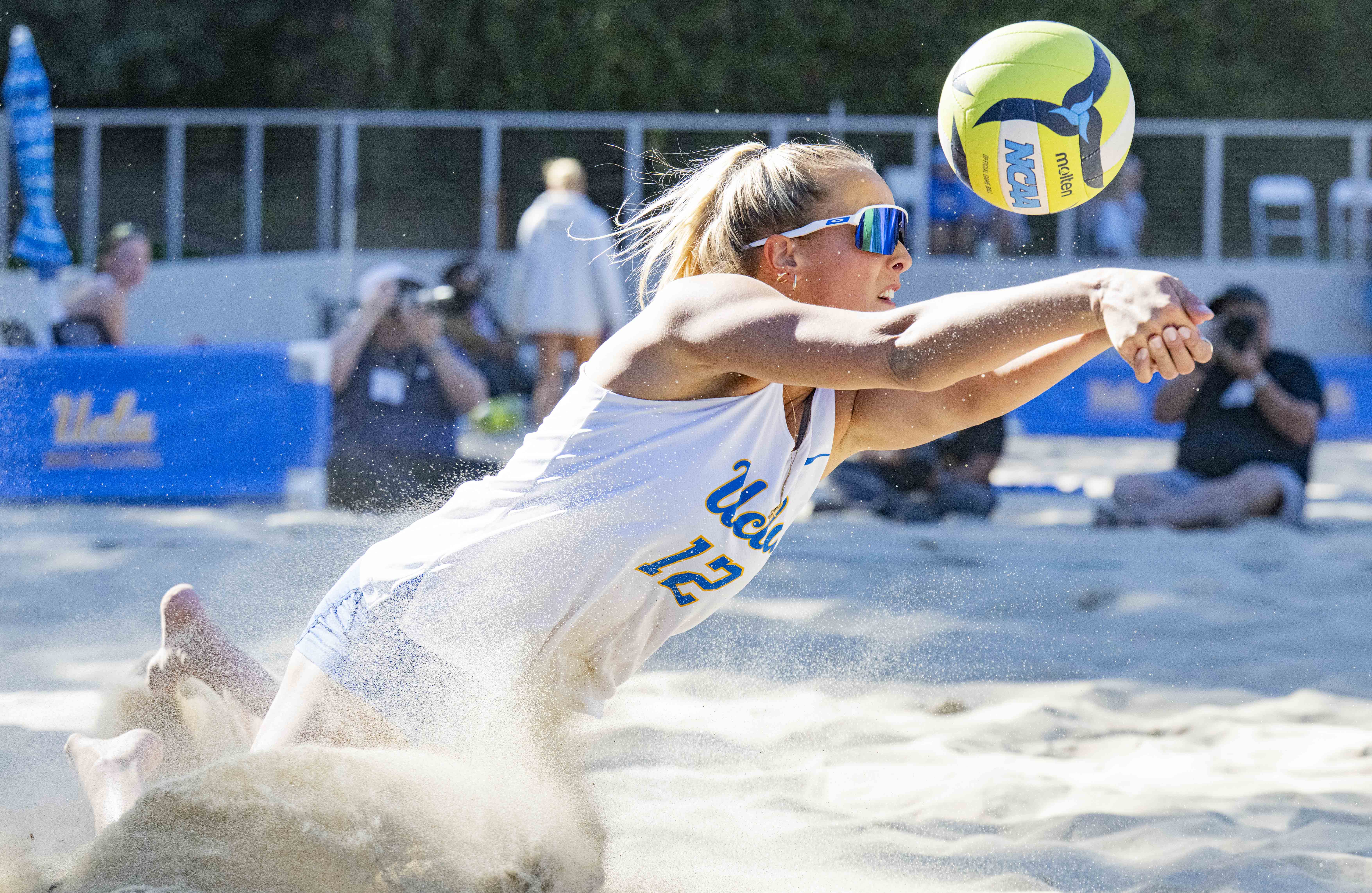 Former Bruin Maggie Boyd dives to pass the ball. Boyd and UCLA beach volleyball won the national championship in 2026. (Holden Yung/Daily Bruin)