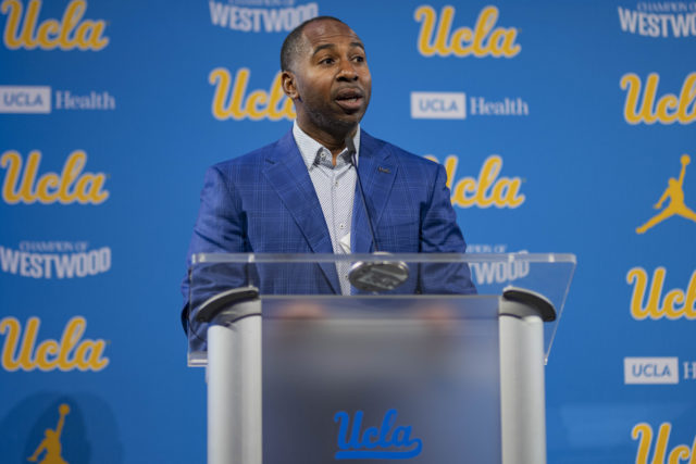Former UCLA athletic director Martin Jarmond speaks at a podium. Jarmond was relieved of his position Monday and will be replaced by former Los Angeles Lakers executive Tim Harris. (Daily Bruin file photo)