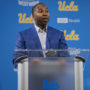 Former UCLA athletic director Martin Jarmond speaks at a podium. Jarmond was relieved of his position Monday and will be replaced by former Los Angeles Lakers executive Tim Harris. (Daily Bruin file photo)