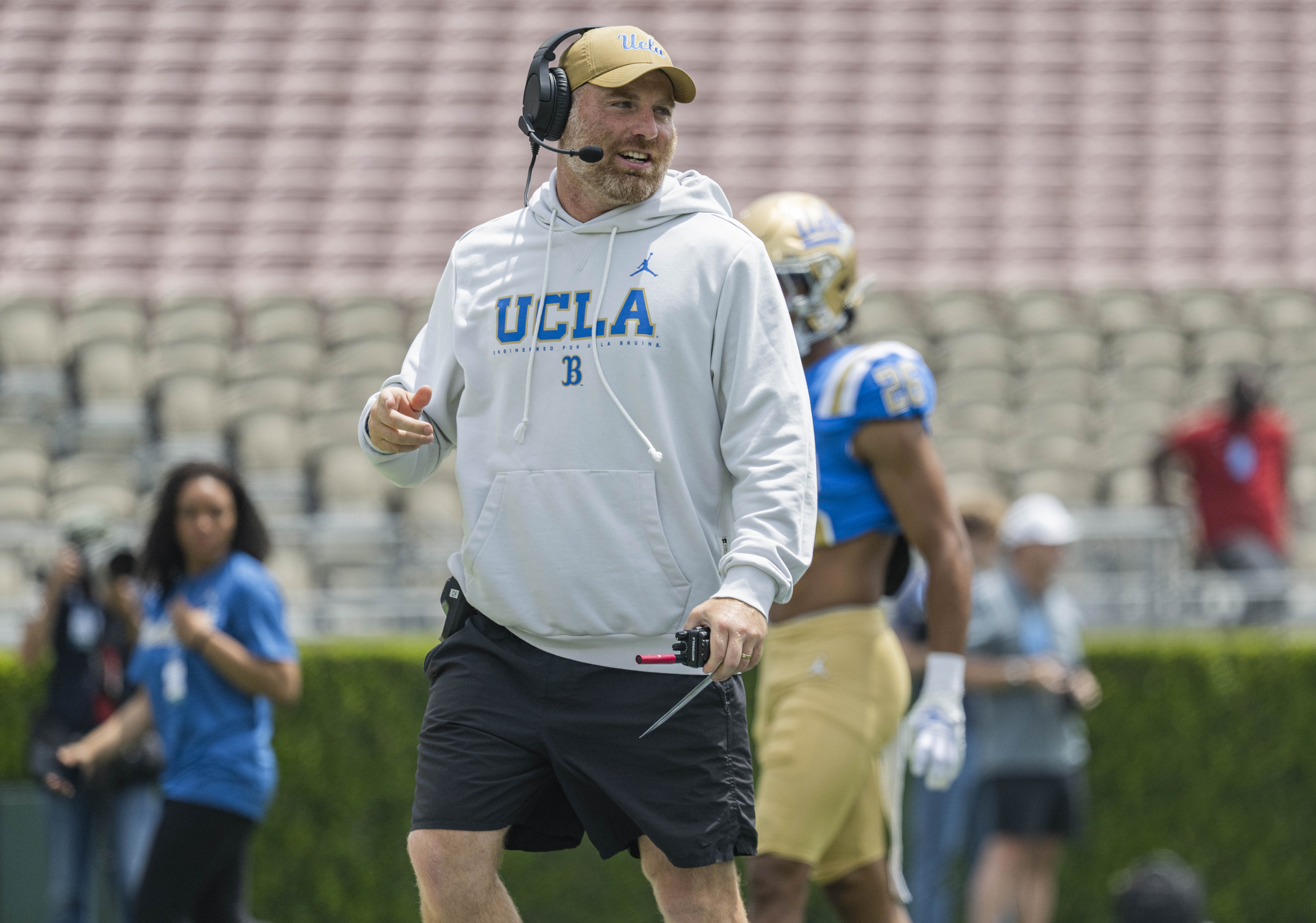 Defensive coordinator Colin Hitschler walks across the field during UCLA’s spring game on Saturday, May 2, 2026, at the Rose Bowl. (Kai Dizon/Assistant Photo editor)
