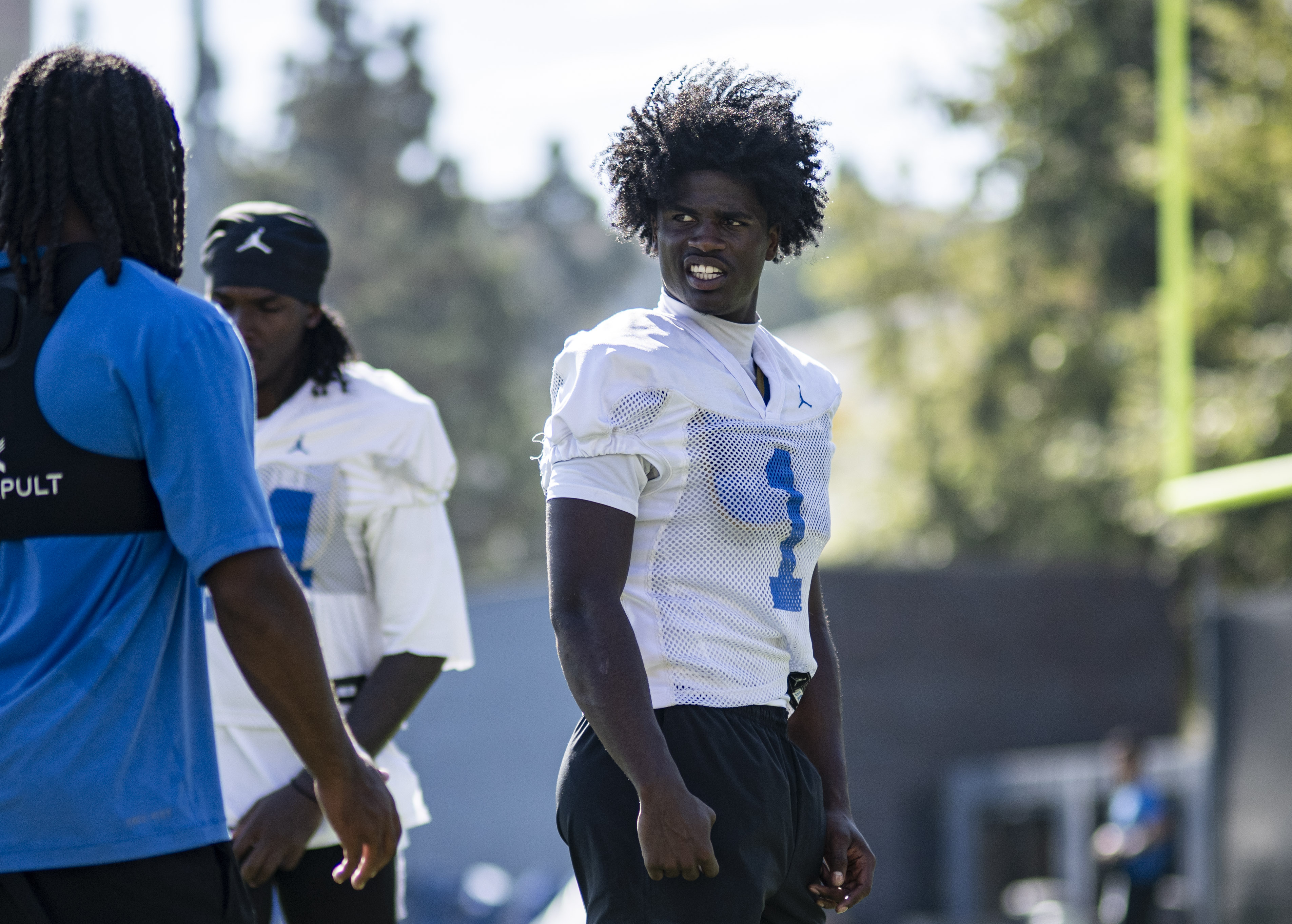 Jackson talks with a teammate during practice on Aug. 7. (Kai Dizon/Assistant Sports editor)