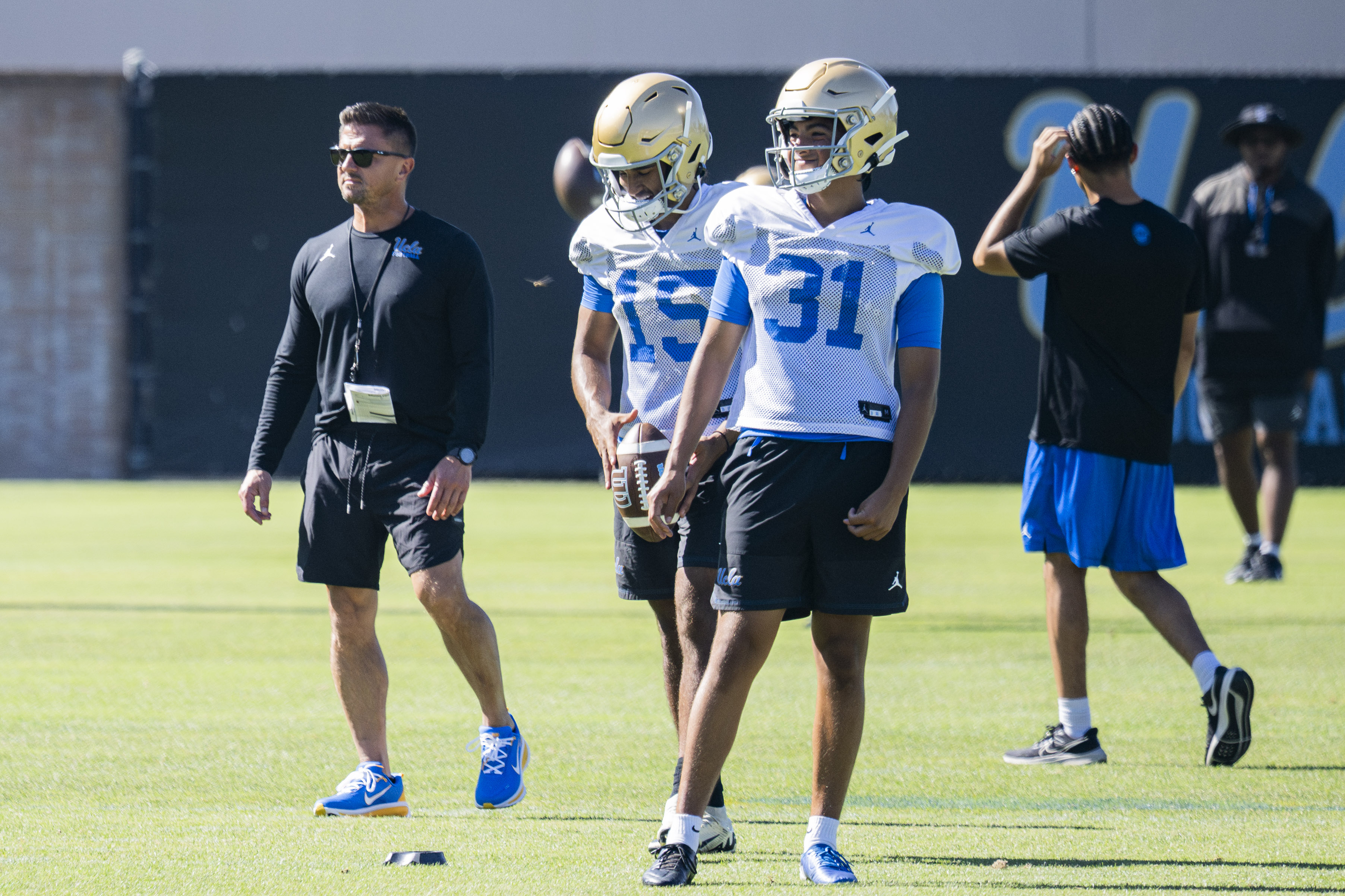 Freshman kicker Mateo Orosco (right) and Bhaghani (left) take turns practicing extra point attempts Aug. 17 at Spaulding Field. (Kai Dizon/Assistant Photo editor)